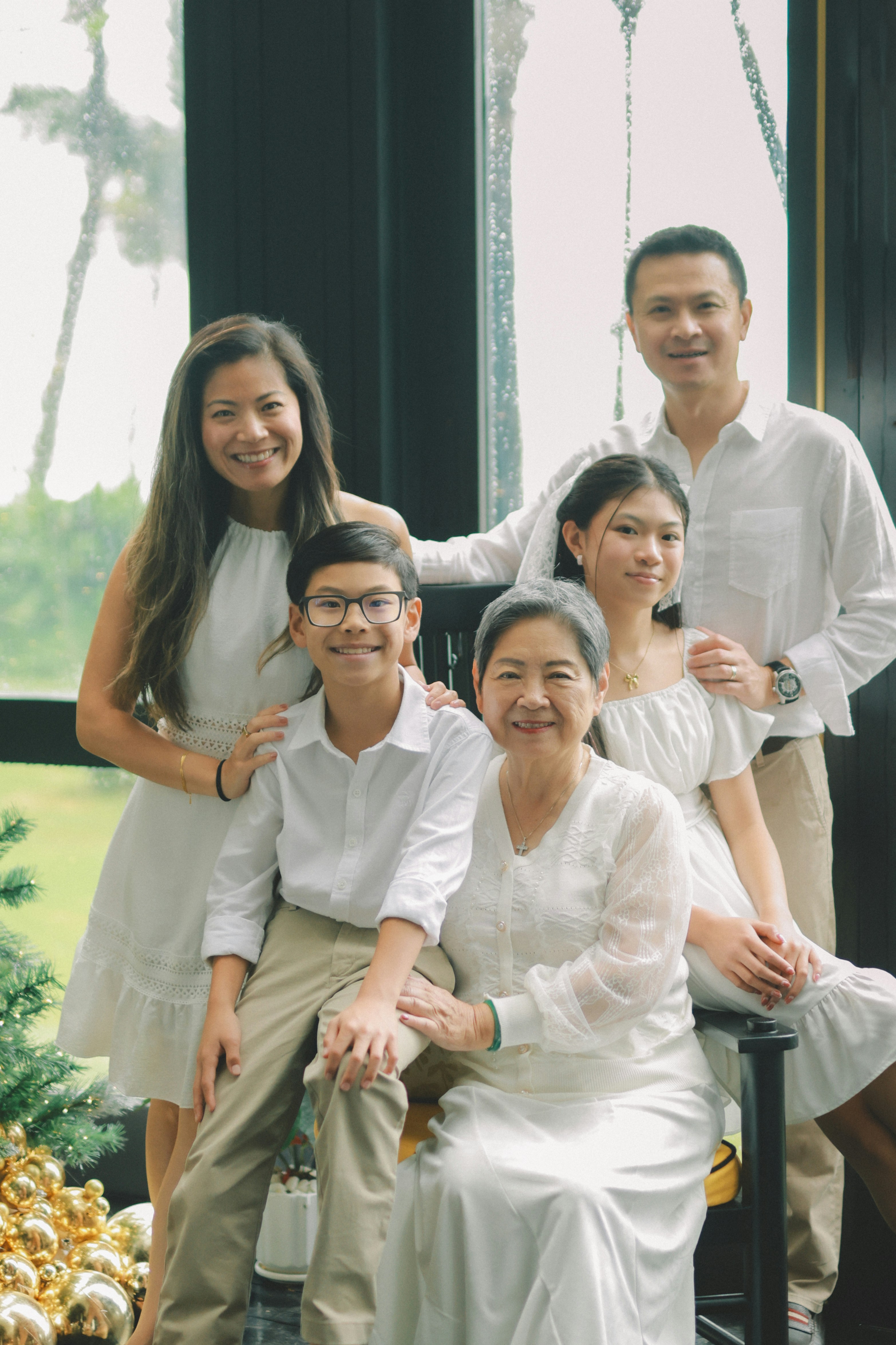 Couple sitting on a dock by a serene lake during sunset, embracing the peaceful evening view.