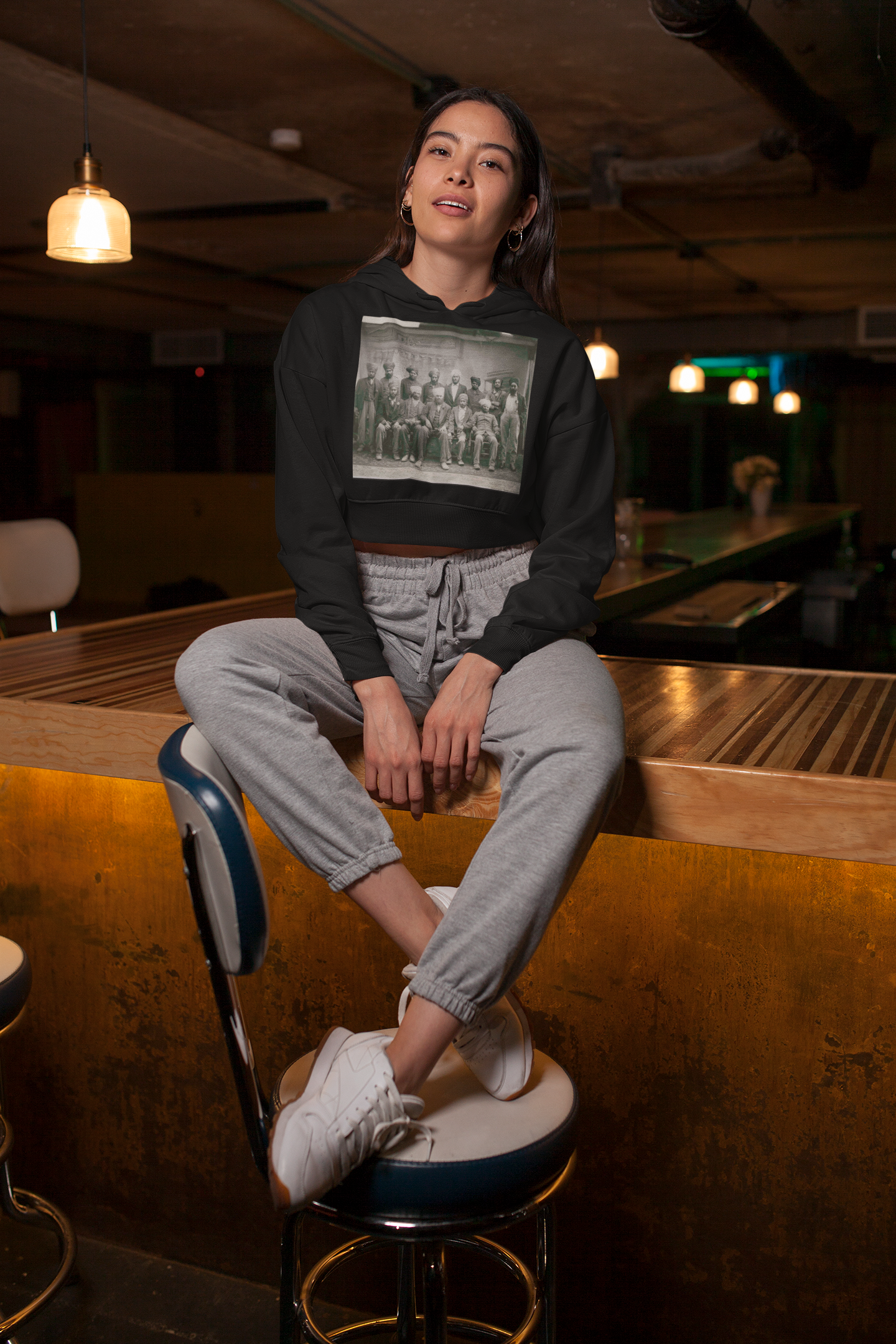 https://0901.nccdn.net/4_2/000/000/057/fca/crop-top-hoodie-featuring-a-woman-sitting-over-a-wooden-bar-gose.png