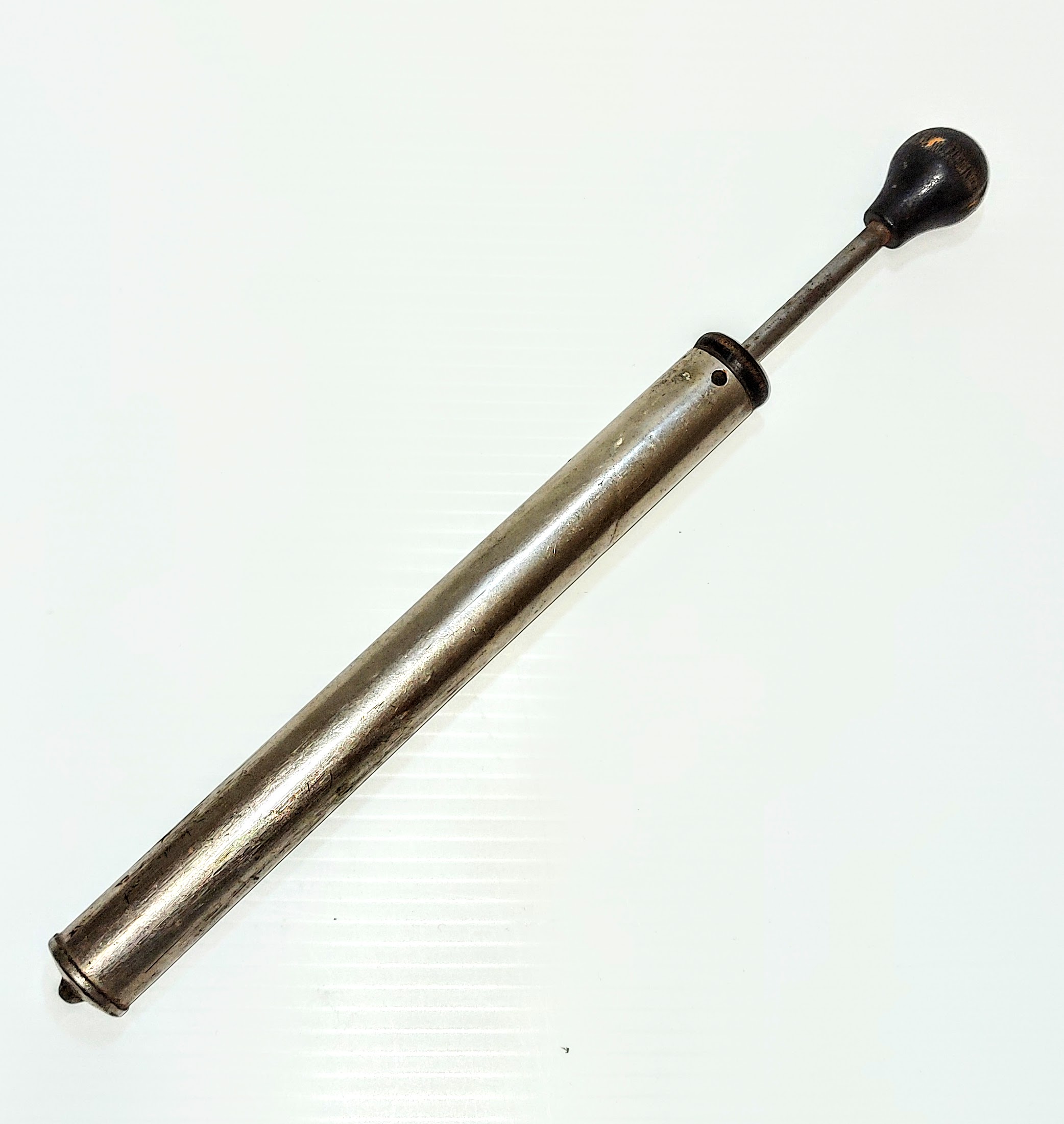 This tubular object is a Pressurized kerosene lamp pump. Such a pump was used to pressurize the fuel chamber of the Kerosene lamp which forced the fuel to atomize and consequently burn hotter and brighter. Though more complex in design and operation, this method provided a much better light source - ideal for a lamp - but was not as fuel efficient.
2000.03.22.01 / Campbell, Jean
01/05/2023