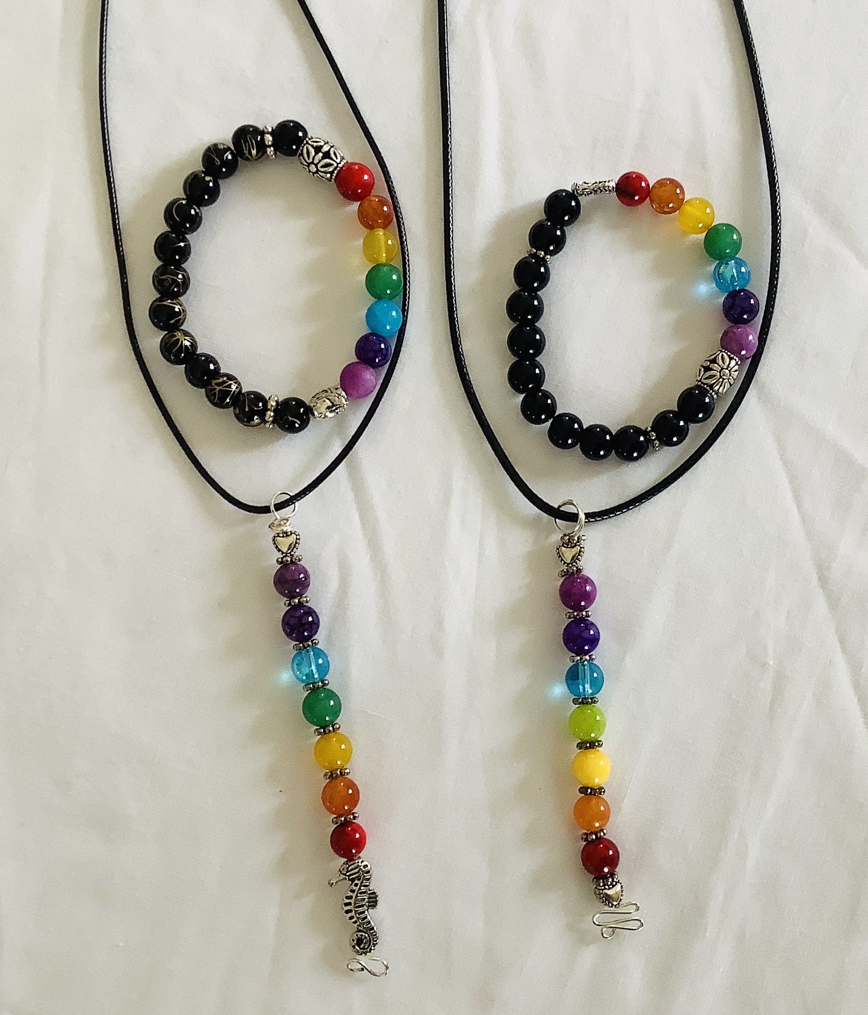 Chakra Pendants and Bracelets. Each piece has the color of each chakra, seven in all, red, orange, yellow, green, blue, purple and light purple.  They are known to be the centers of spiritual power in the human body.  Pendant $20.00 Bracelet $20.00
