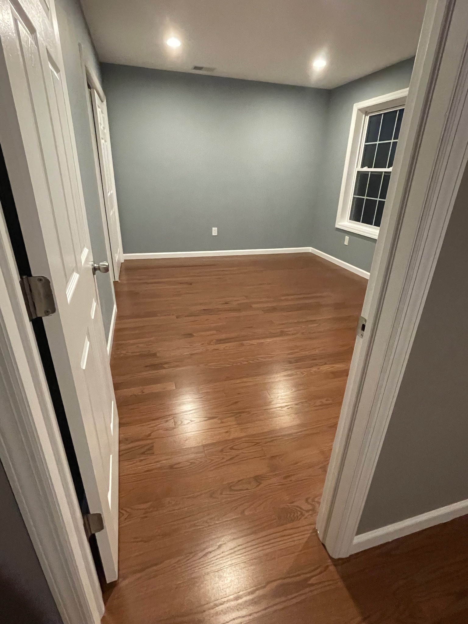 Organized Pantry with White Shelving and Refrigerated Storage