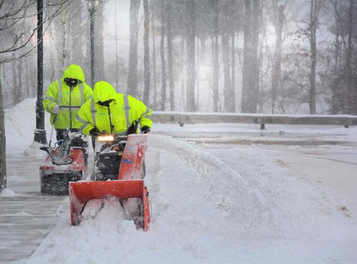Professional Snow Removal Using Snow Blowers in Heavy Snow