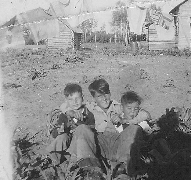 Does anyone recognize these three lads? They appear to be contentedly hanging out in the corn patch underneath the laundry line on a sunny summers day - but we don't recognize them! Unfortunately there is no date or location for the photo.
2017.42.05 / Lizotte, Ramsey & Maria
--EDIT--
These are the Lizotte brothers (L-R) Ramsey, Rupert aka "Six Toes", and Albert.