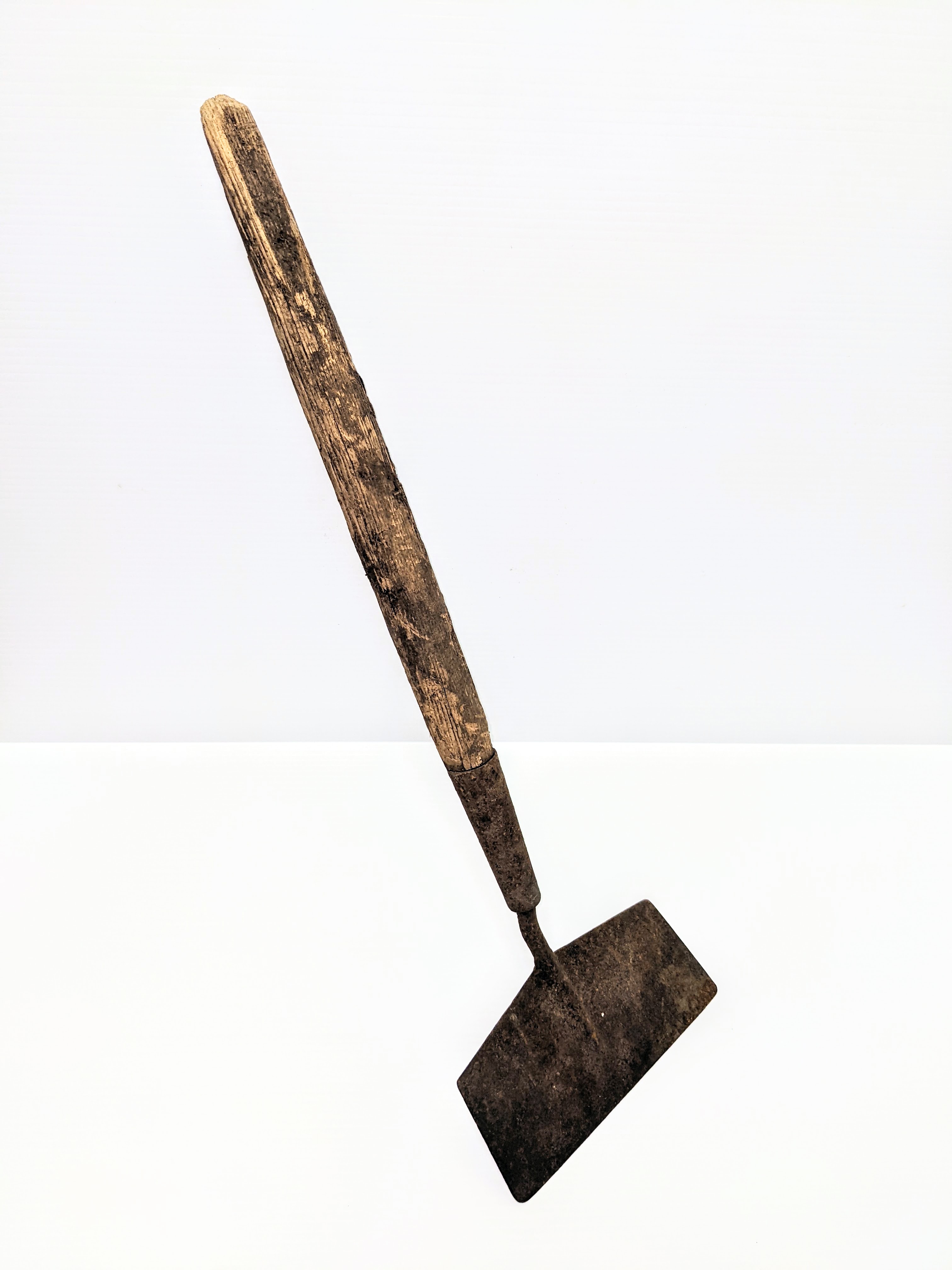 Check out this garden Hoe! It has a solid steel blade and wooden handle. The handle is short and appears to be a result of the wood breaking - perhaps due to aggressive weeding. You'll also notice that the angle of the blade is quite shallow which is likely for a specific purpose - what that purpose might be we do not know!
In any case, it saw good use during it's time at the experimental Farm.
996.39.5 / Clayton, George