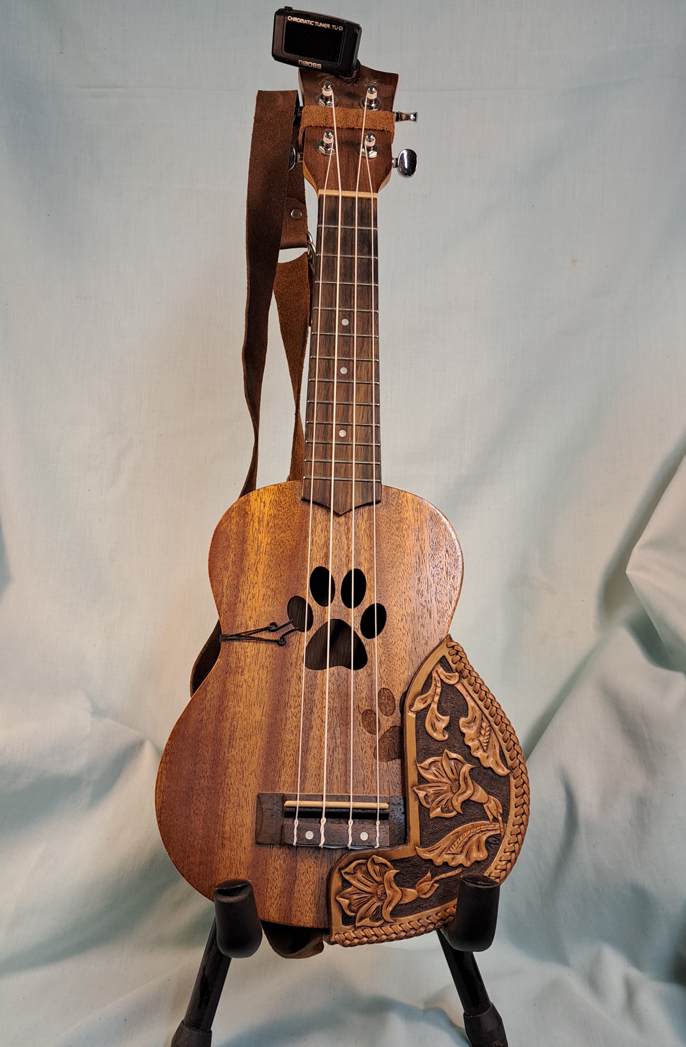 A guitar on a stand with custom detailing