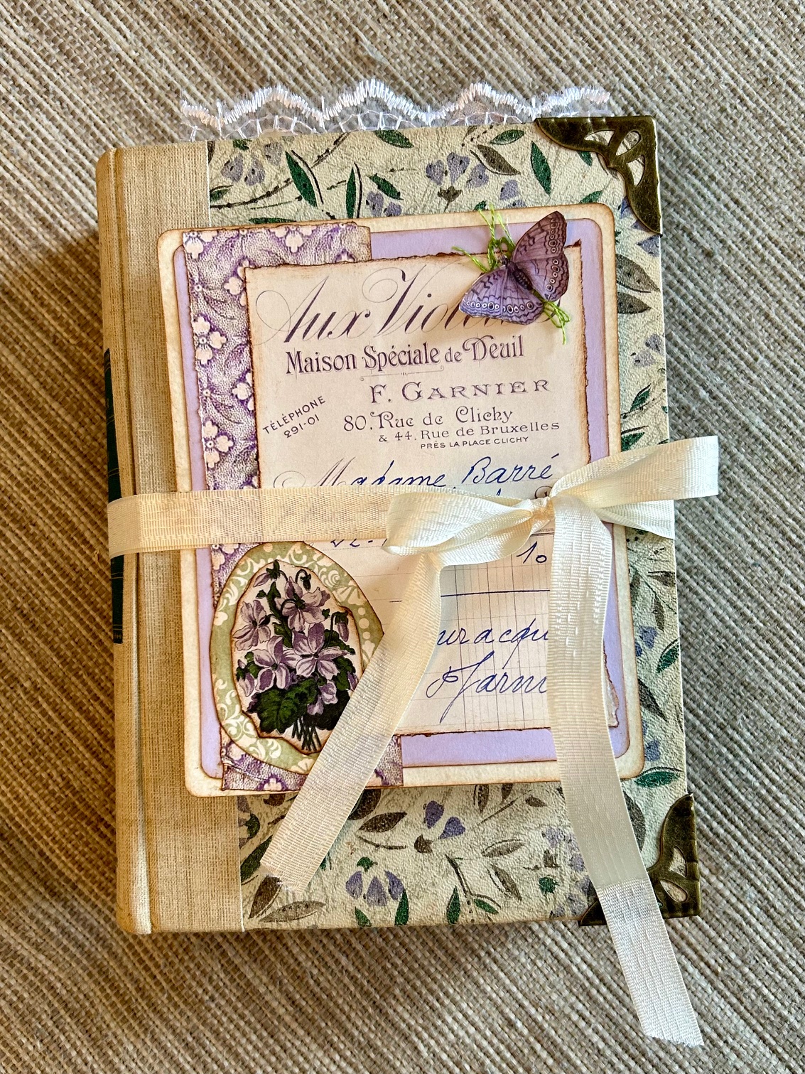 Decorative vintage book with floral, lavender and lace accents,  and a removable journal topper. Full of pockets and lots of writing spaces.