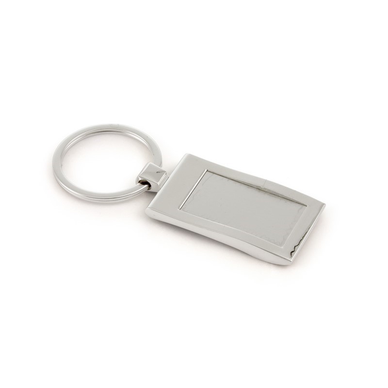 Flat lay of branded items including a box, bottle, coasters, smartphone, and business cards, all featuring the 'MaV' logo on a black surface.