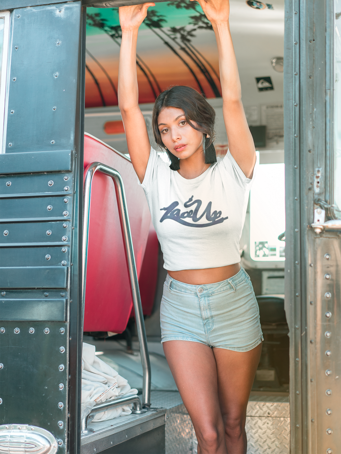 https://0901.nccdn.net/4_2/000/000/060/85f/latina-girl-wearing-a-tshirt-holding-to-a-bus-door-gosexyca.png