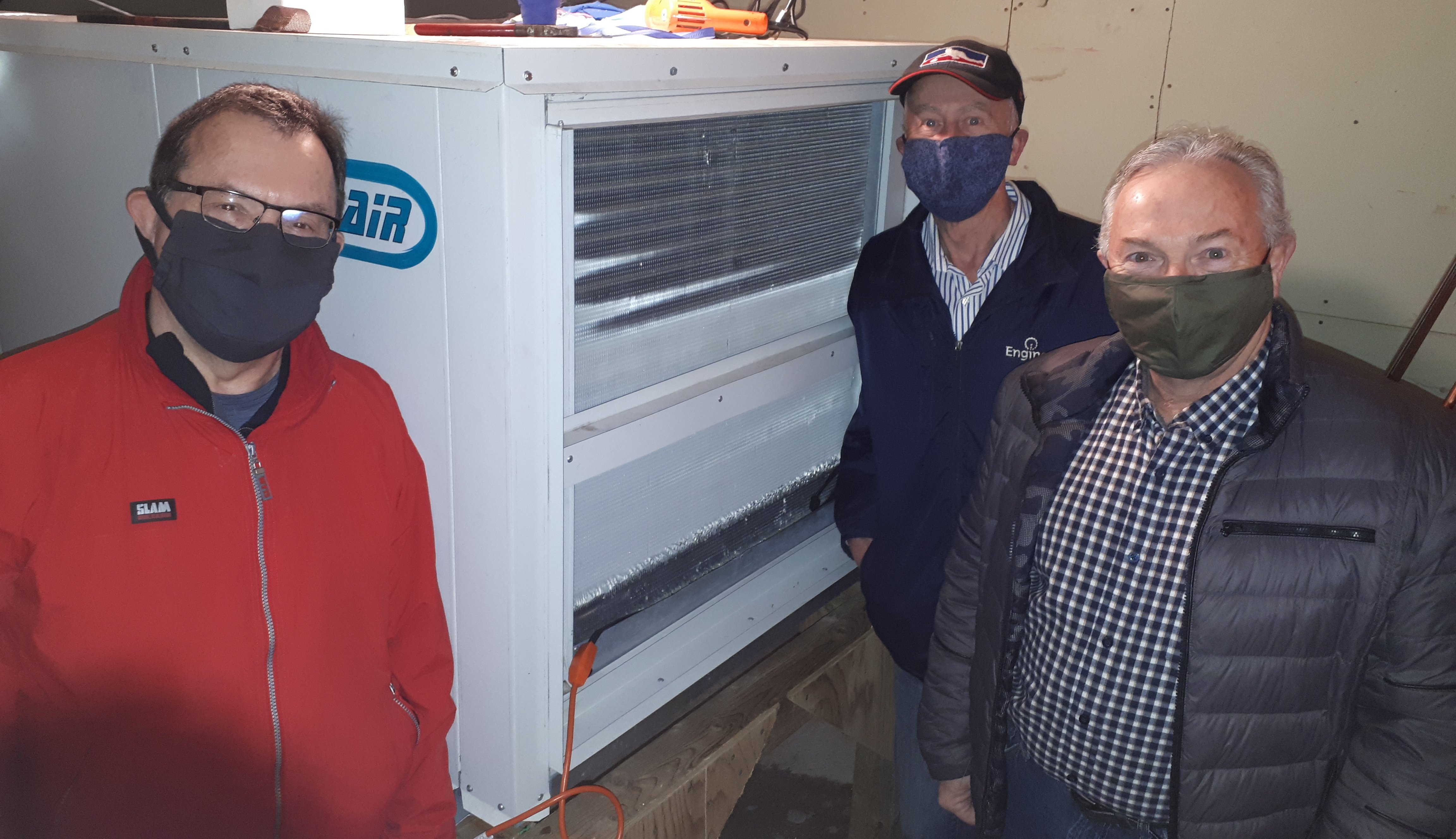 Lorne Deering, Harry Daemen and Owen McCarron with the repaired dehumidifier