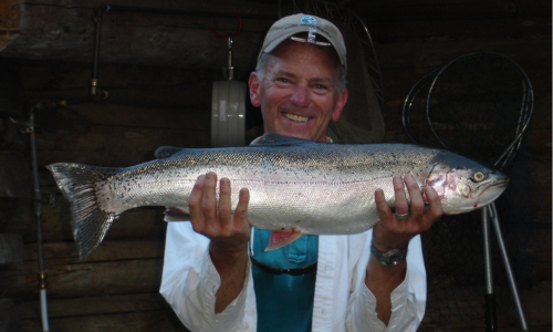 Camp Guest Holding a Trout
