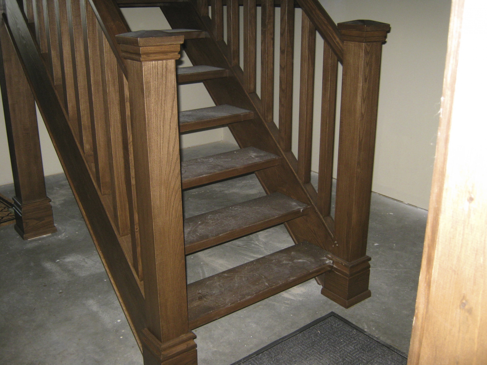 Straight ash Scandinavian style stair with closed stringers