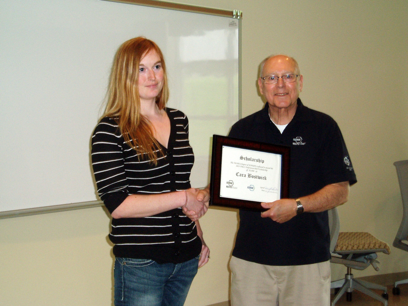 Dwight Scott presents Cara Bostwick of NBCC Fredericton a $1000 ASHRAE Scholarship from the NB/PEI Chapter.