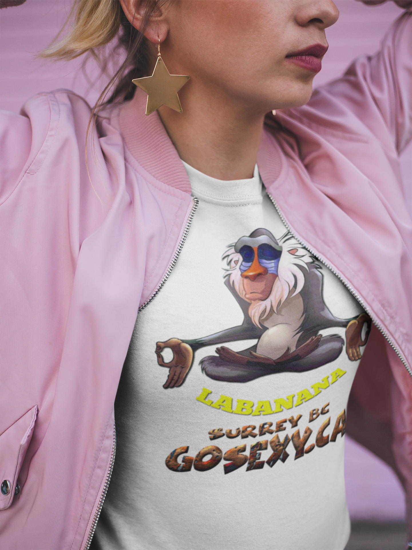 https://0901.nccdn.net/4_2/000/000/064/d40/closeup-t-shirt-of-a-woman-wearing-a-pink-jacket-and-star-earrin.png