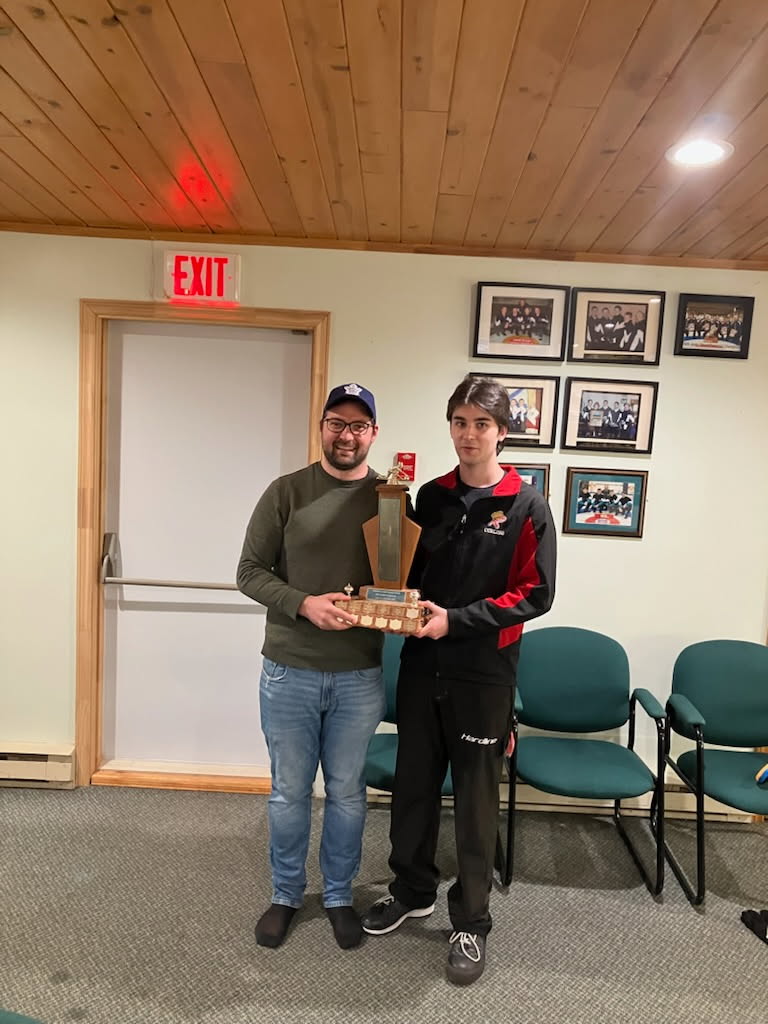 Most Improved Player Simon Nicholson (right). Presented by previous recipient KC Cupido