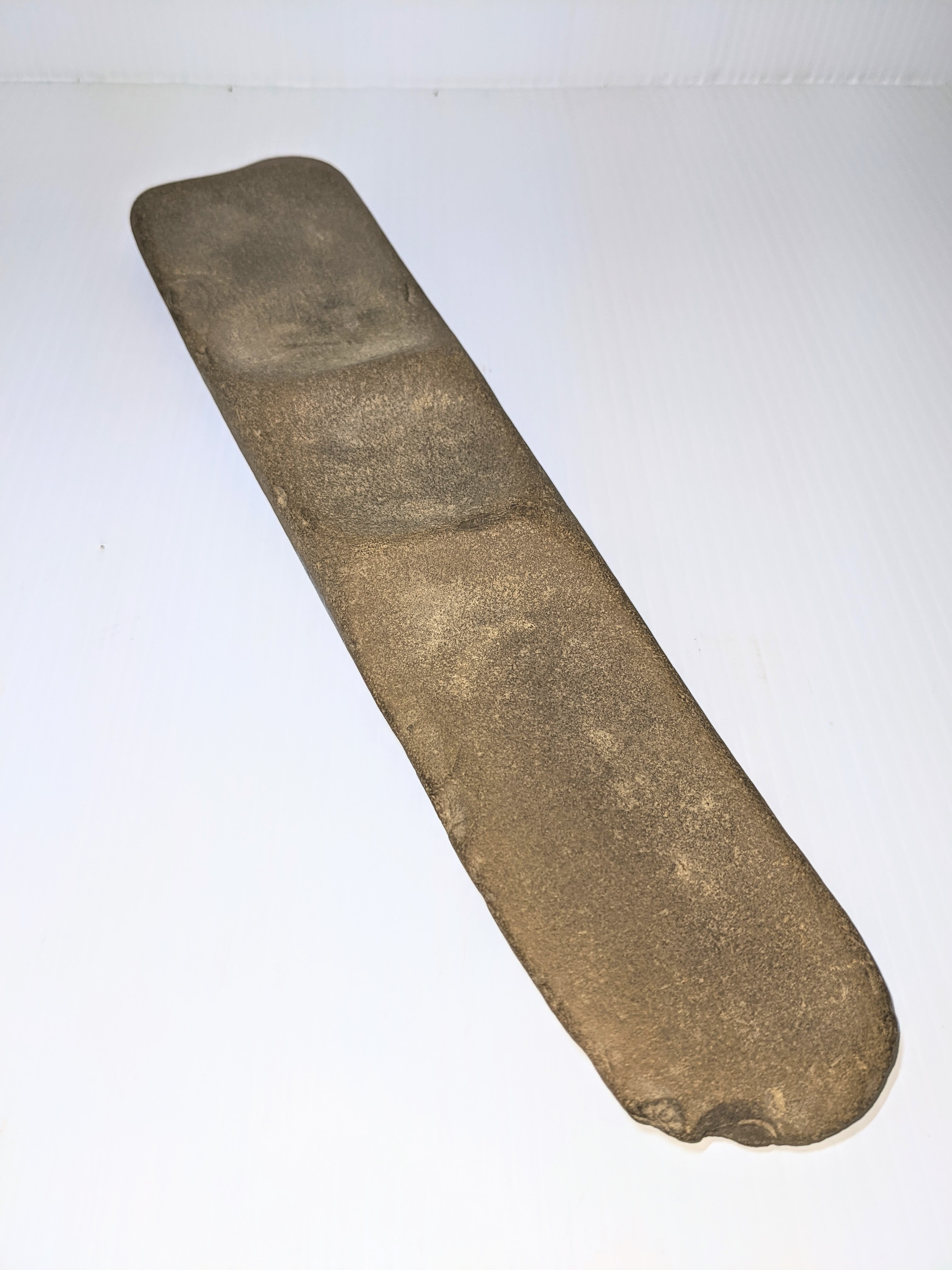 The artifact of the week is this unknown object. It is made of stone, has four depressions (3 visible on this side and one round one on the backside) and has the texture of fine sandpaper. Our best guess is a grindstone of some capacity - but we welcome your thoughts on what it's purpose may be! 
PS. It was found in a gravel pit near Fort - which just adds to the mystery! 
2003.18.01 / Lambert, Don