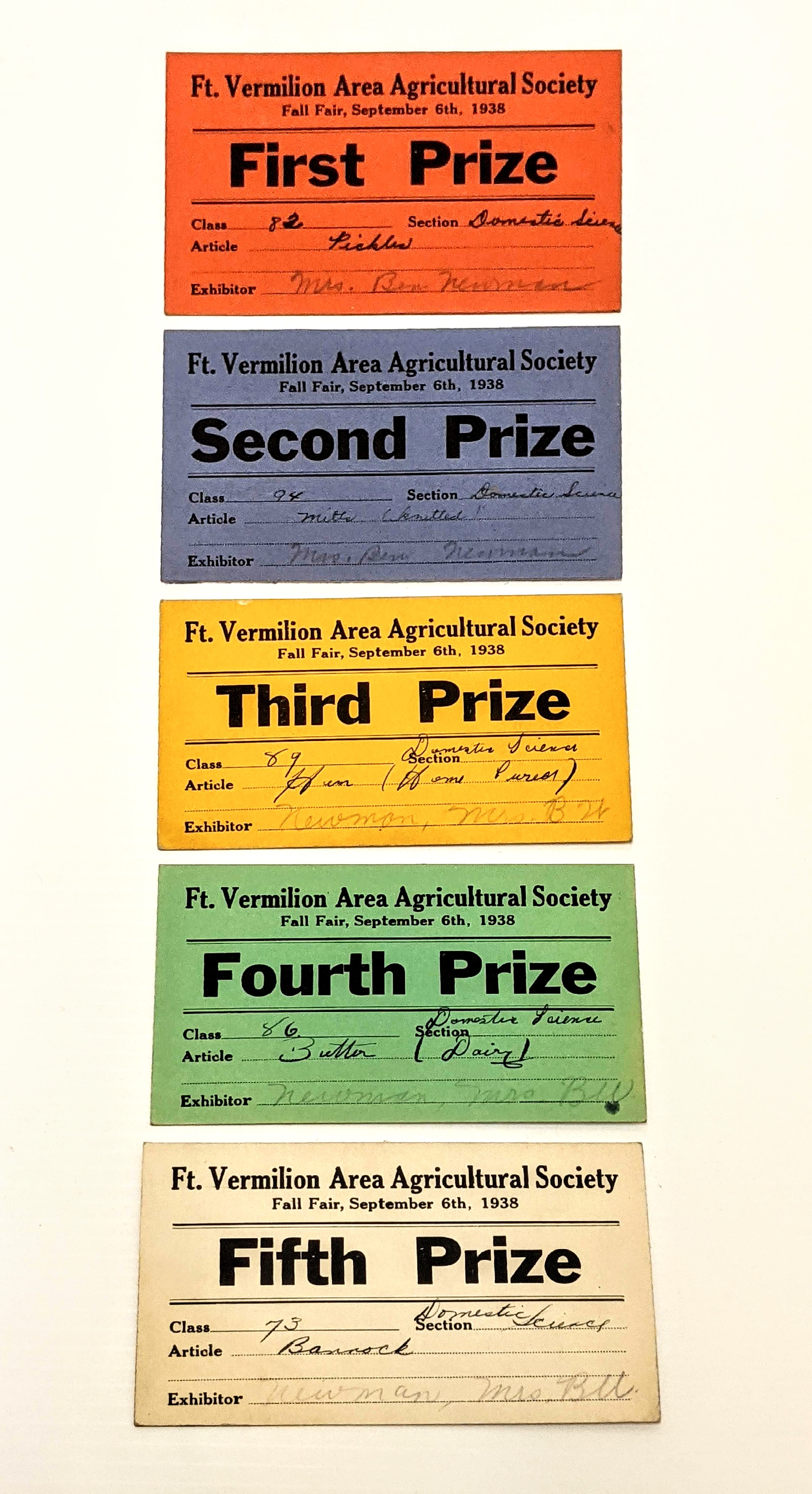 These are prize cards from the Fort Vermilion Fall fair of 1938! Awarded to Mrs. Ben Newman (Dorothea) they represent only a small selection of her winnings that year. From our records, Dorothea won 8 firsts, 4 Seconds, 6 Thirds, 5 Fourths and 2 fifths that year in the bench show - and likely had many other entries. Most of her entries are from the Domestic Sciences section, and as you can see in the picture, range from knitted mitts to bannock and cured hams. Such winnings at this years Bench show (Aug 11 + 12 at the MARA grounds) would have earned Dorothea $38 plus a chance at the Grand exhibitor prize of $300!
998.01.18 / Newman, Jack and Pearl