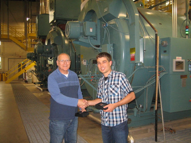 Dwight Scott presenting a token of appreciation to Fred Bernard, one of the tour guides from MCW Maricor.  Dumont Energy Centre Tour