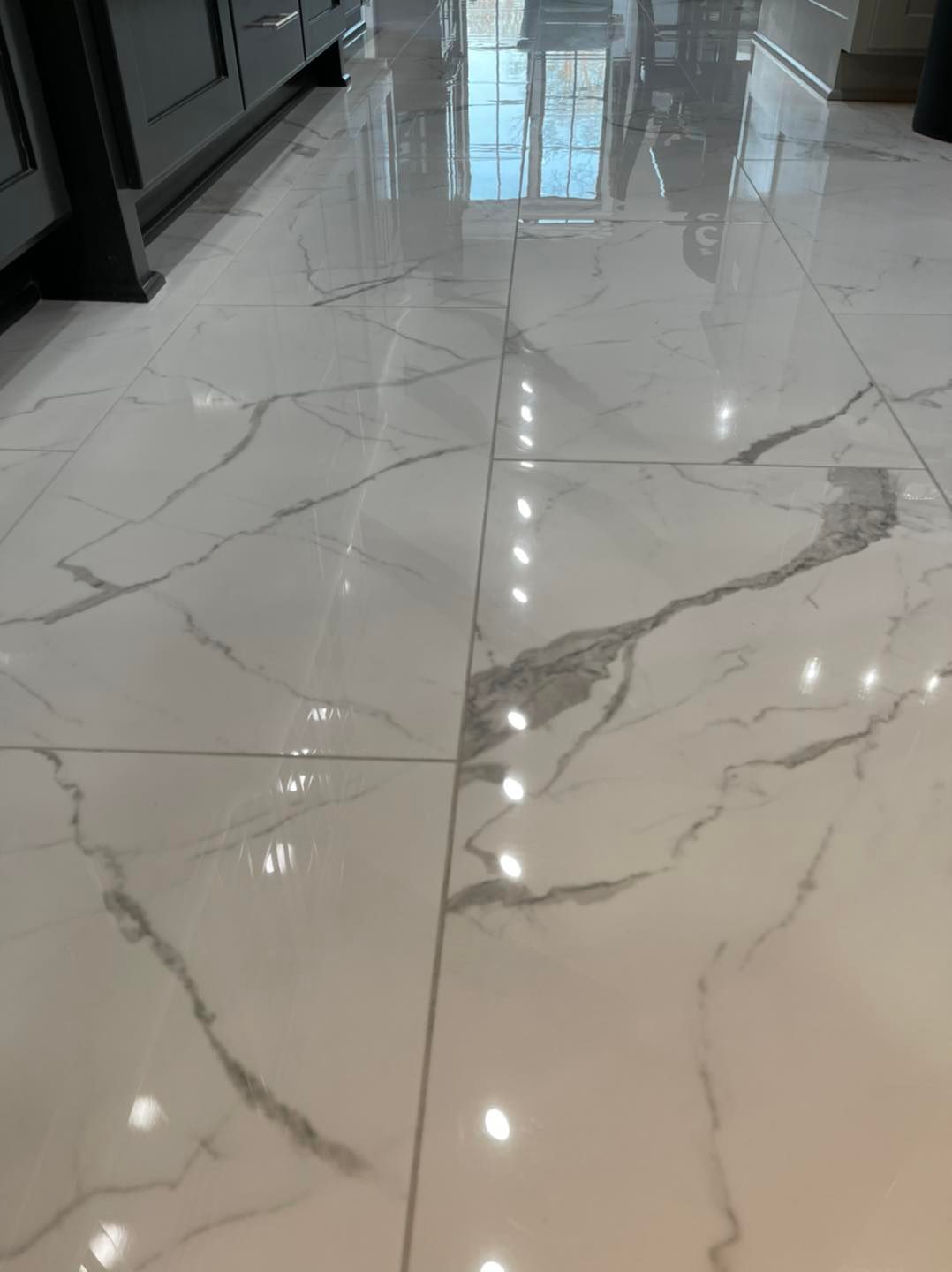 Polished Marble-Patterned Tile Floor After Professional Cleaning