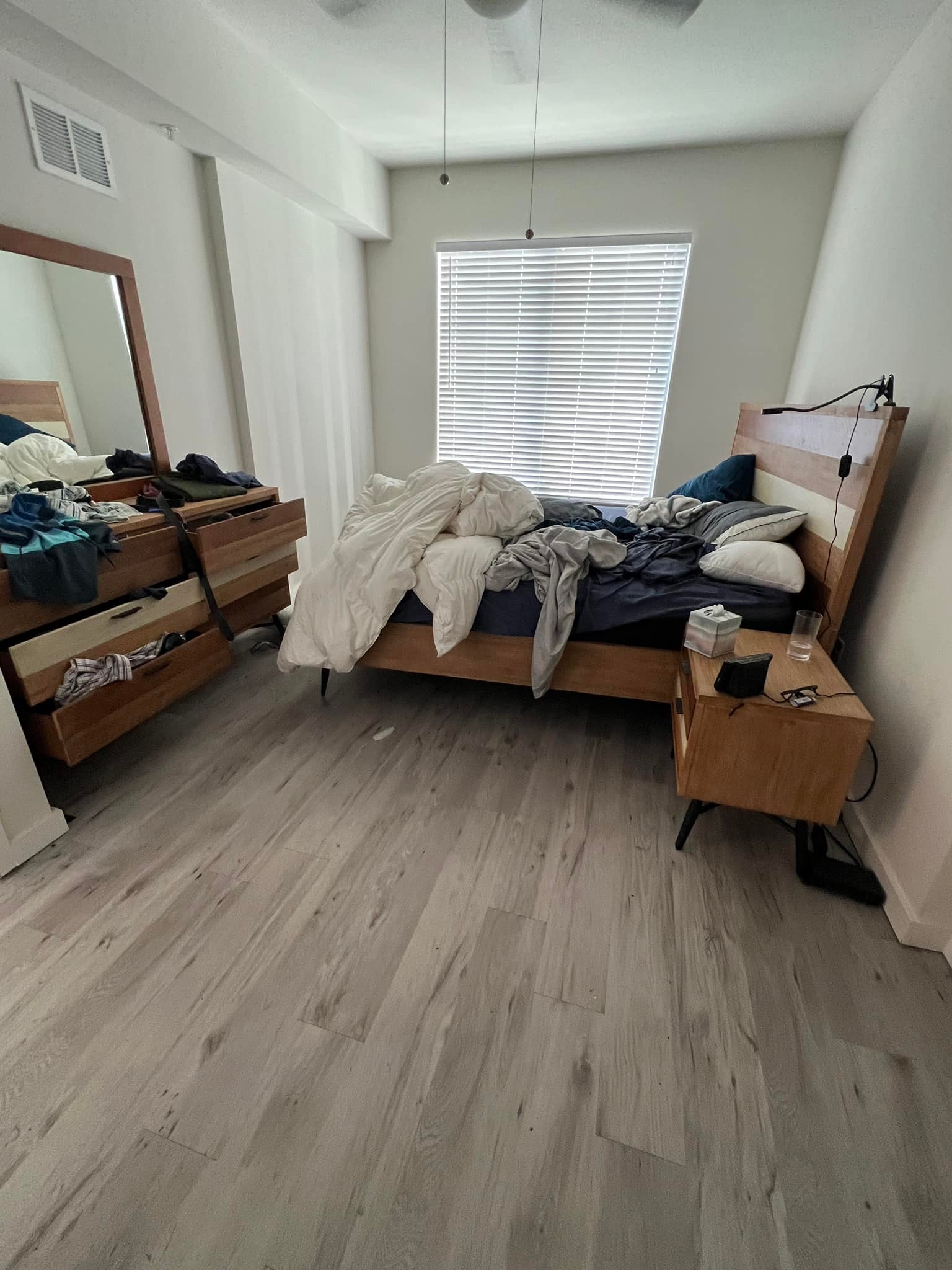 Deep cleaning Toronto – occupied condo bedroom before Deep Clean Reset with unmade bed and active living conditions