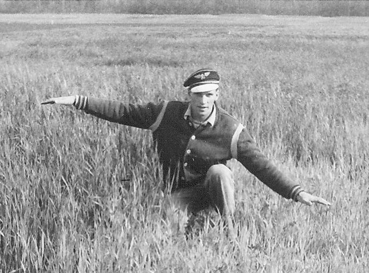 Though it looks like this is a high flying ace casually cruising through a grass field - this young man is actually attempting to show the discrepancy between fertilized and unfertilized grass. The picture comes from the experimental farm and though it is dated 1956 - we don't know who he is. If you do - please get in touch!
993.4.50.1 / Agriculture Canada