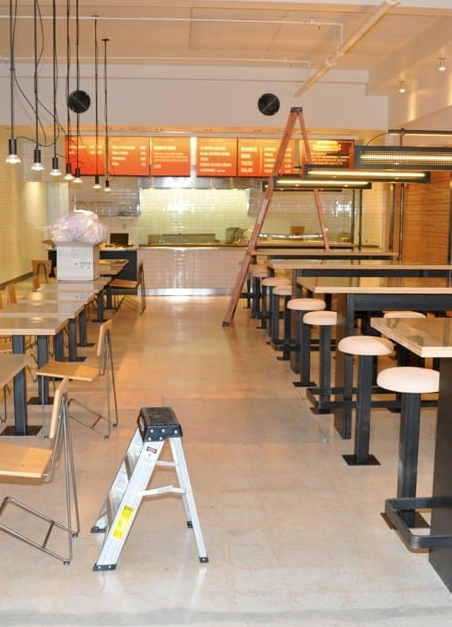 Commercial restaurant interior restored following post-renovation recovery and prepared for operational readiness