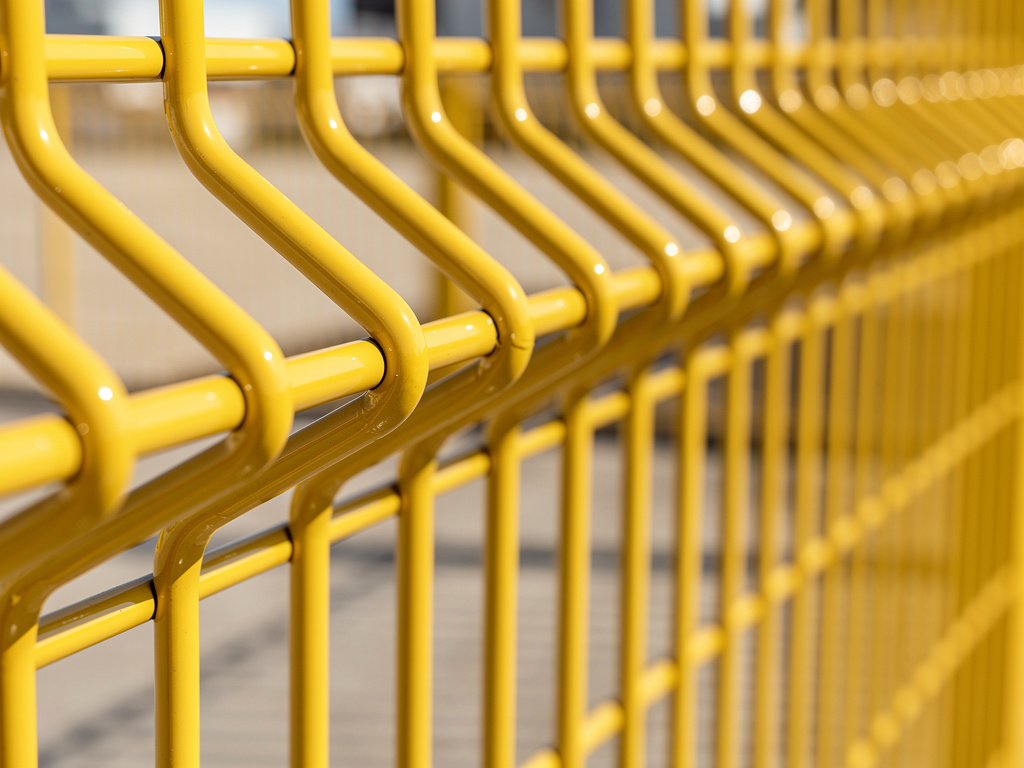 Automotive paint shop with car body panels on conveyor line and workers in factory