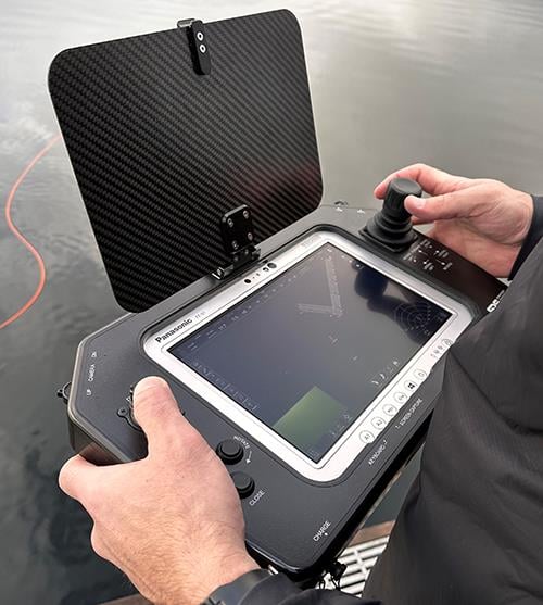 person diving on body of water