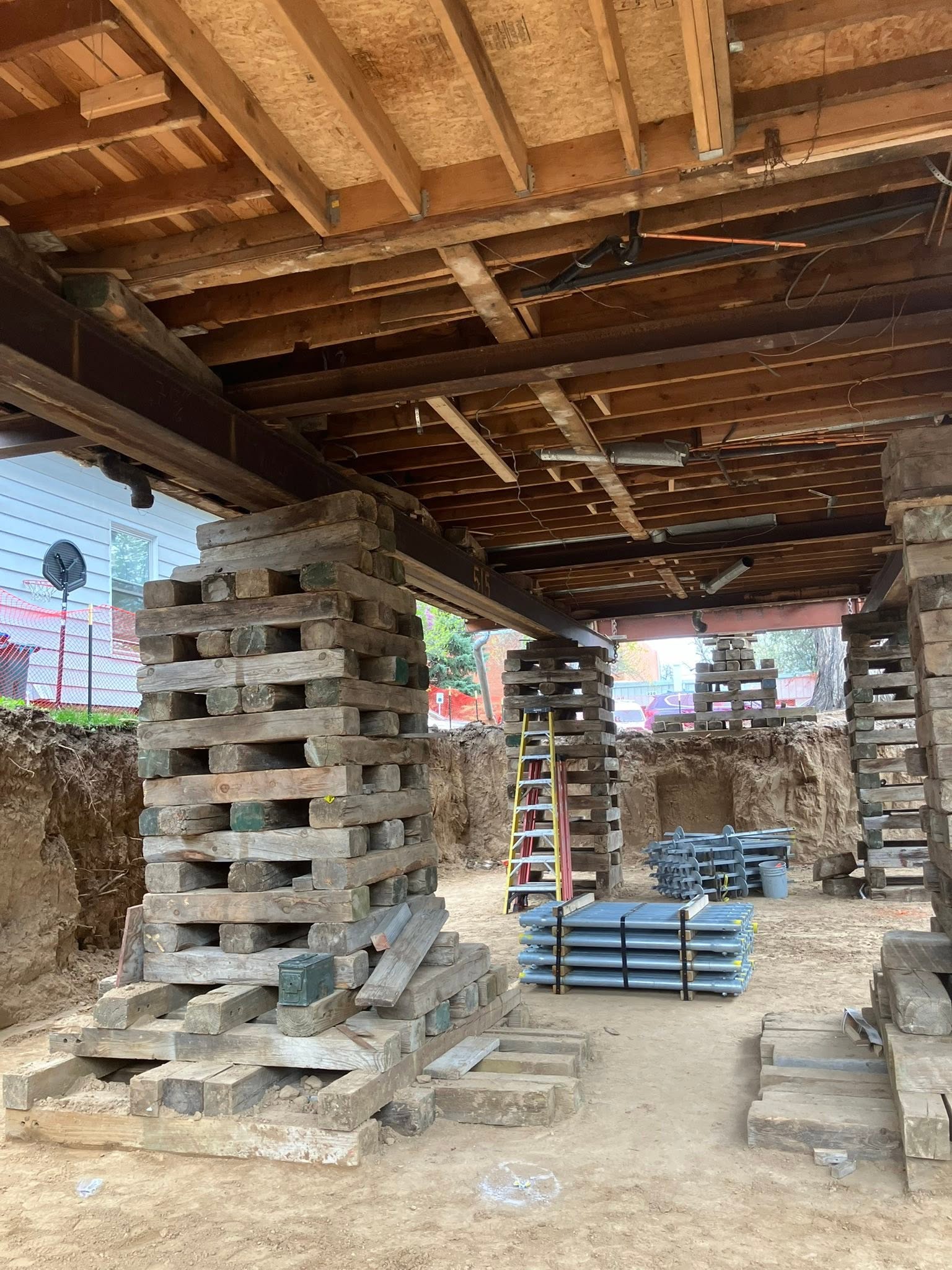 https://0901.nccdn.net/4_2/000/000/06b/a1b/house-lifting-building-on-beams.jpg