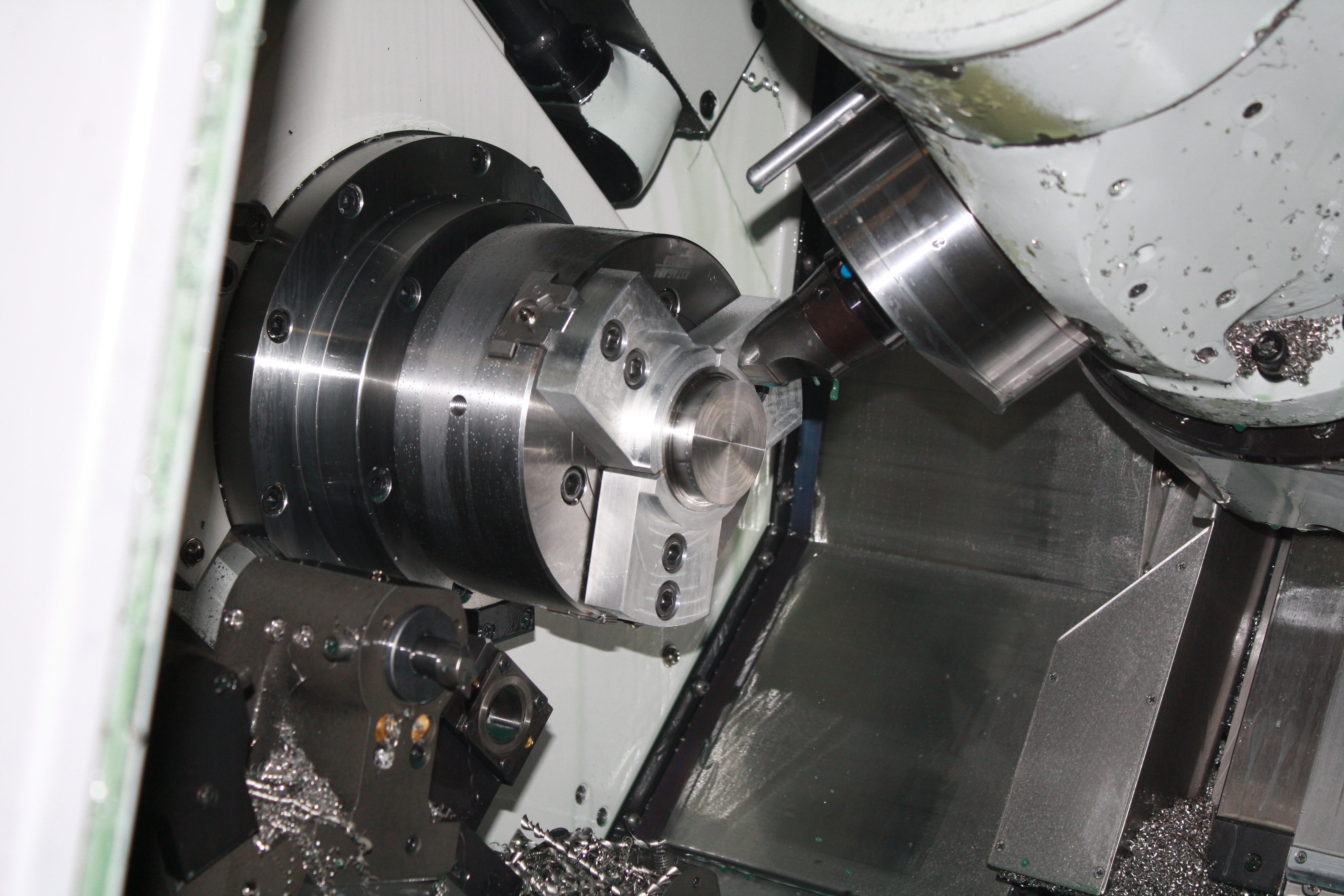 Close-up of intricate metal gears and components in a mechanical assembly.