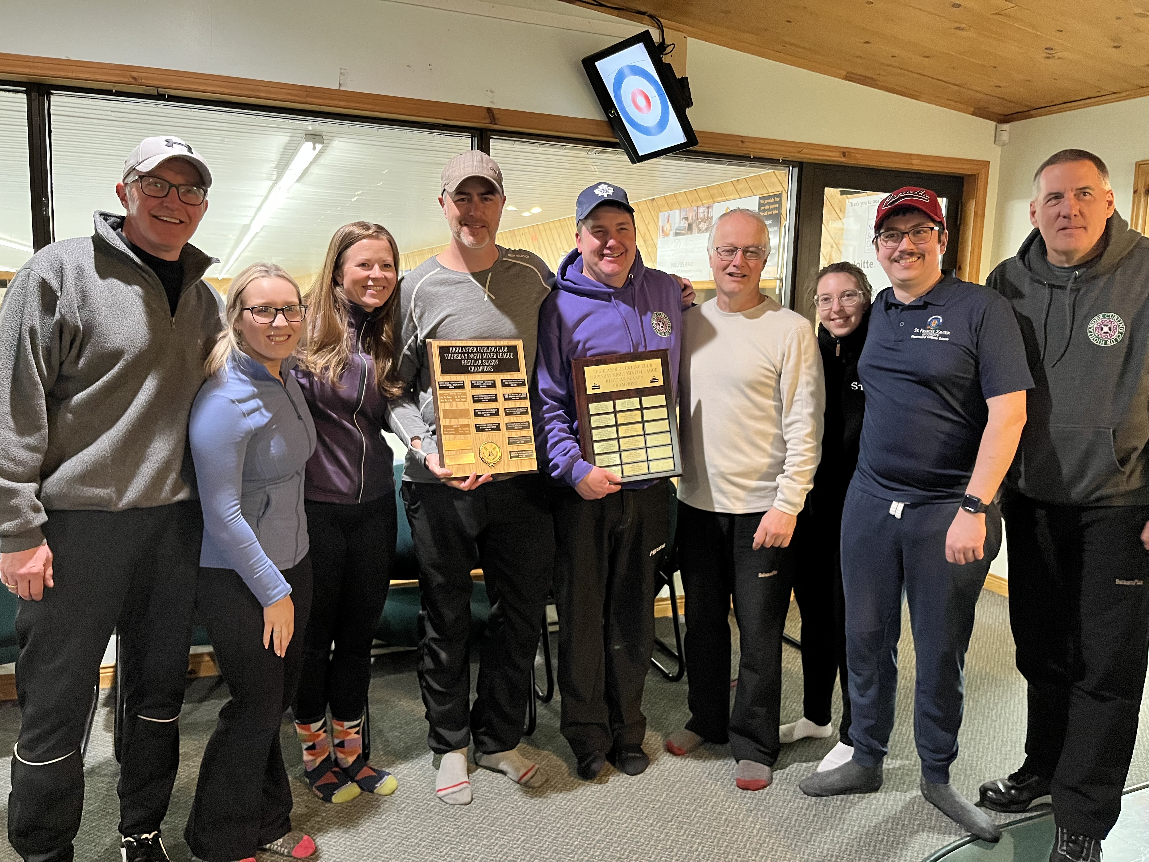 Thursday Night Mixed Season Champions in a first time ever tie (LtoR): Team Druhan - David MacKenzie, Deidra Fraser, Candace MacKenzie and Derek Druhan. Team Campbell - Eric Lumsden, Doug Campbell, Pia Cabannes and Jean-Alexis Delamer. Presented by 2021-2022 Season Champion - Johnny Duykers
