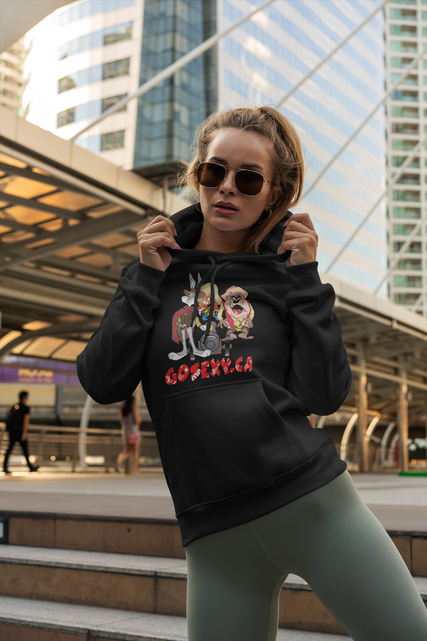 https://0901.nccdn.net/4_2/000/000/06b/a1b/of-a-trendy-woman-posing-with-a-hoodie-next-to-a-bridge-gosexyca.png