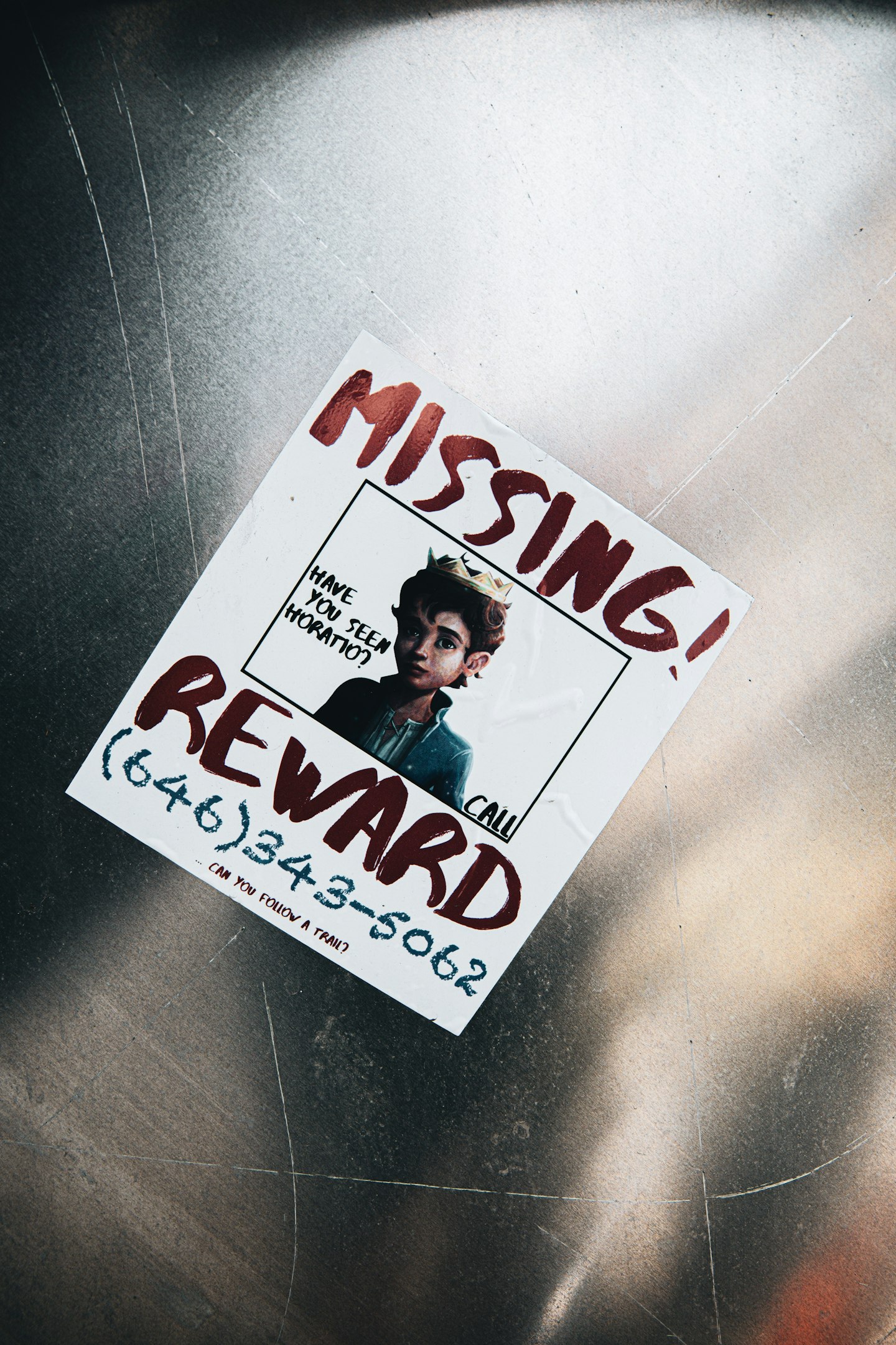 Person analyzing data on multiple monitors in a modern office setting, focusing on digital displays of graphs and analytics.