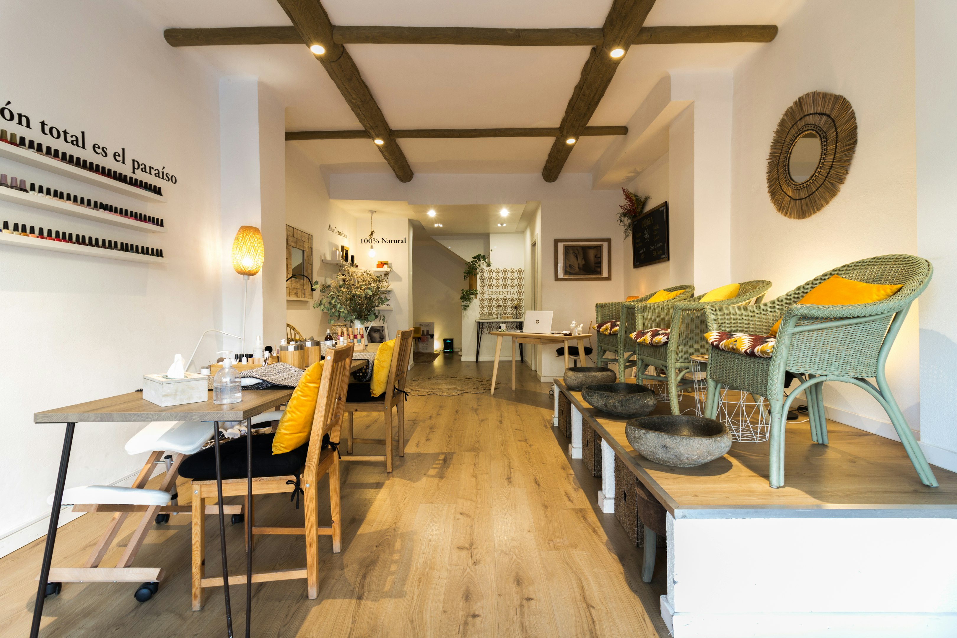 a restaurant with wooden floors and white walls