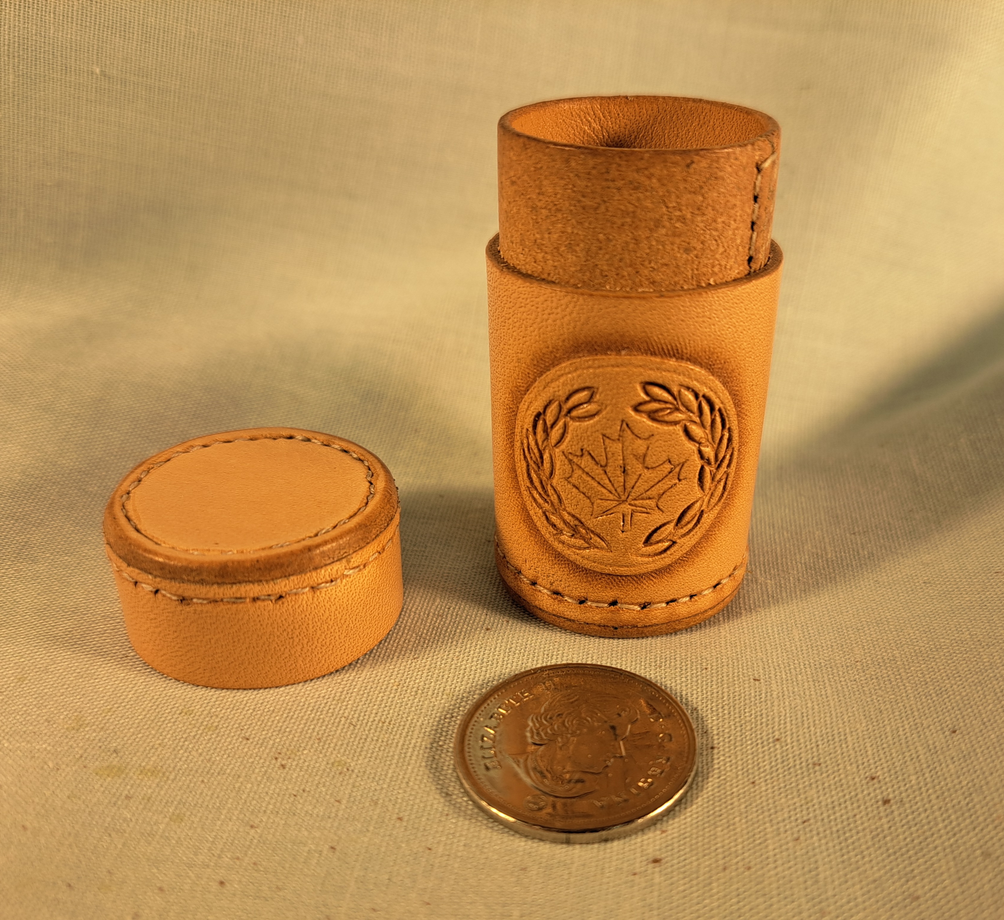 Small customer leather bottle with cap