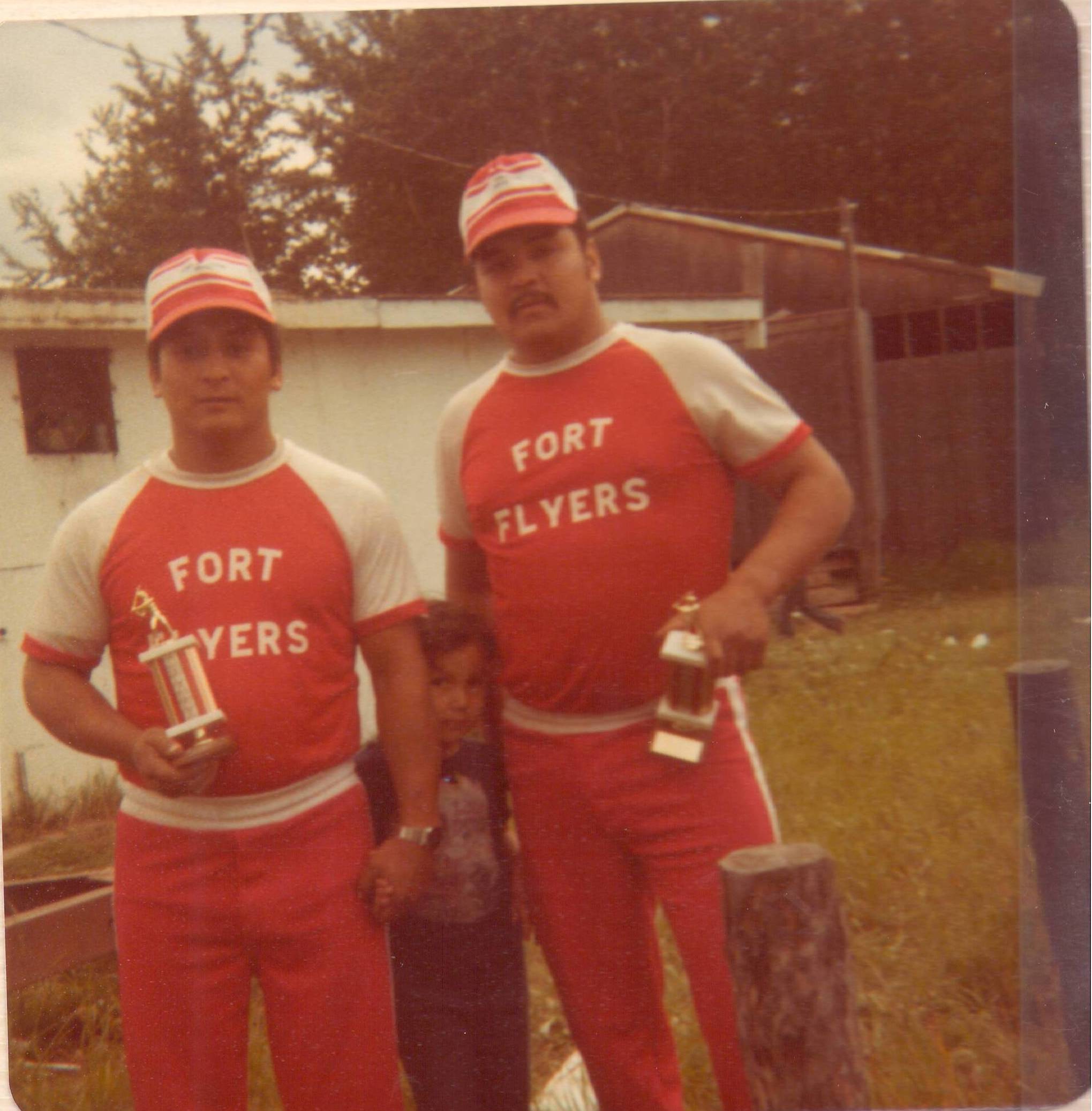 Does anyone recognize these two "Fort Flyers"? Their trophies indicate they are winners - with uniforms that great how could you not be? Also, if anyone recognizes the child - we would love to identify them as well!
2019.24.556 / Lizotte, Maria
--EDIT--
(L-R) William and Westley Ducharme wearing the Fort Flyers baseball uniform.
Judy Ducharme is the child in the middle.