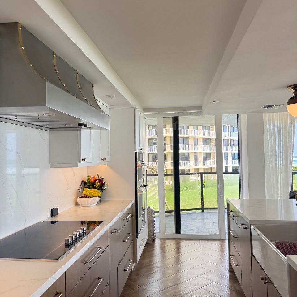 Bright Modern Kitchen with Island and Balcony View