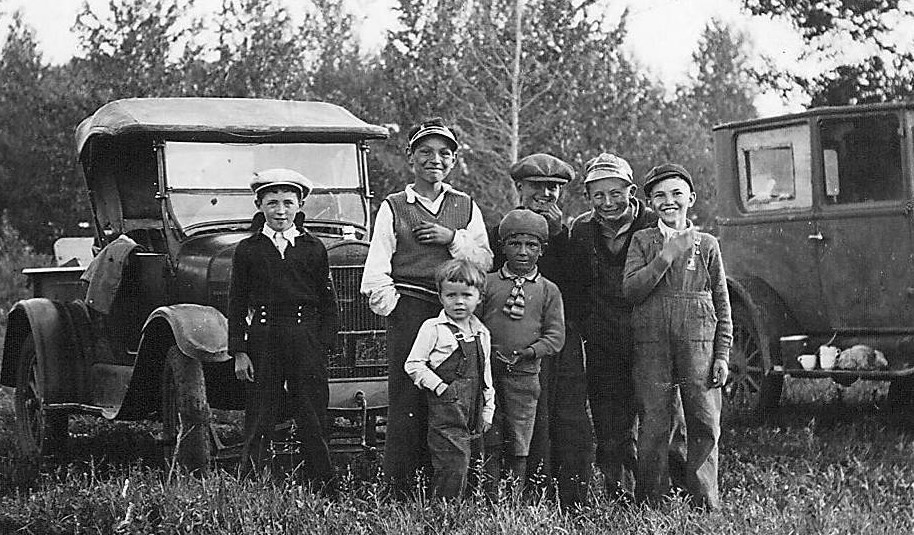 These young bucks look to be having an excellent afternoon. The vehicles and teacups on the running boards tell us they are part of a larger picnic group which they appear to be enjoying. Jim Henry is the smartly dressed boy on the left and his younger brother Bruce is the child in front wearing the white shirt - the others are unknown. Jim and Bruce are sons of Norman Henry who was the Manager of the HBC post in Fort Vermilion from 1931- 1937.
2003.08.08 / Henry, Jim