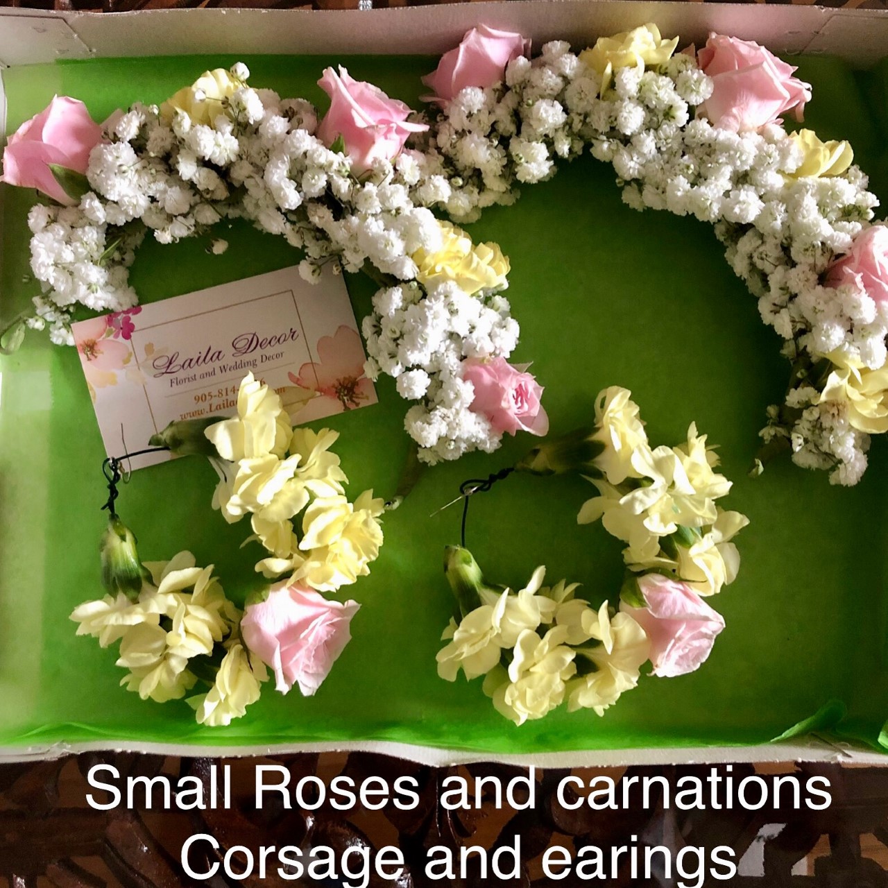 $85 Small roses and carnations Hand corsage and earings 