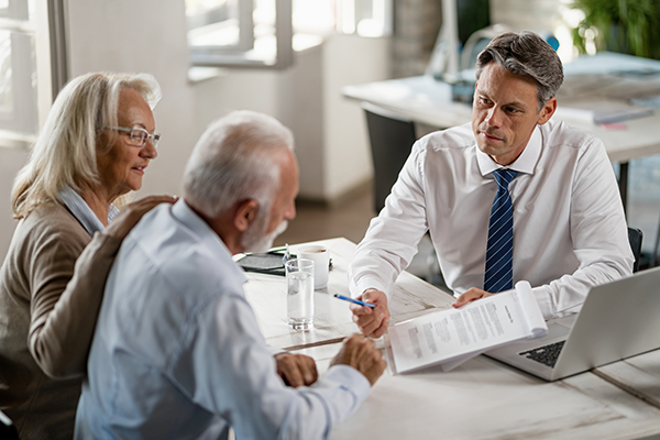 matured couple with insurance expert