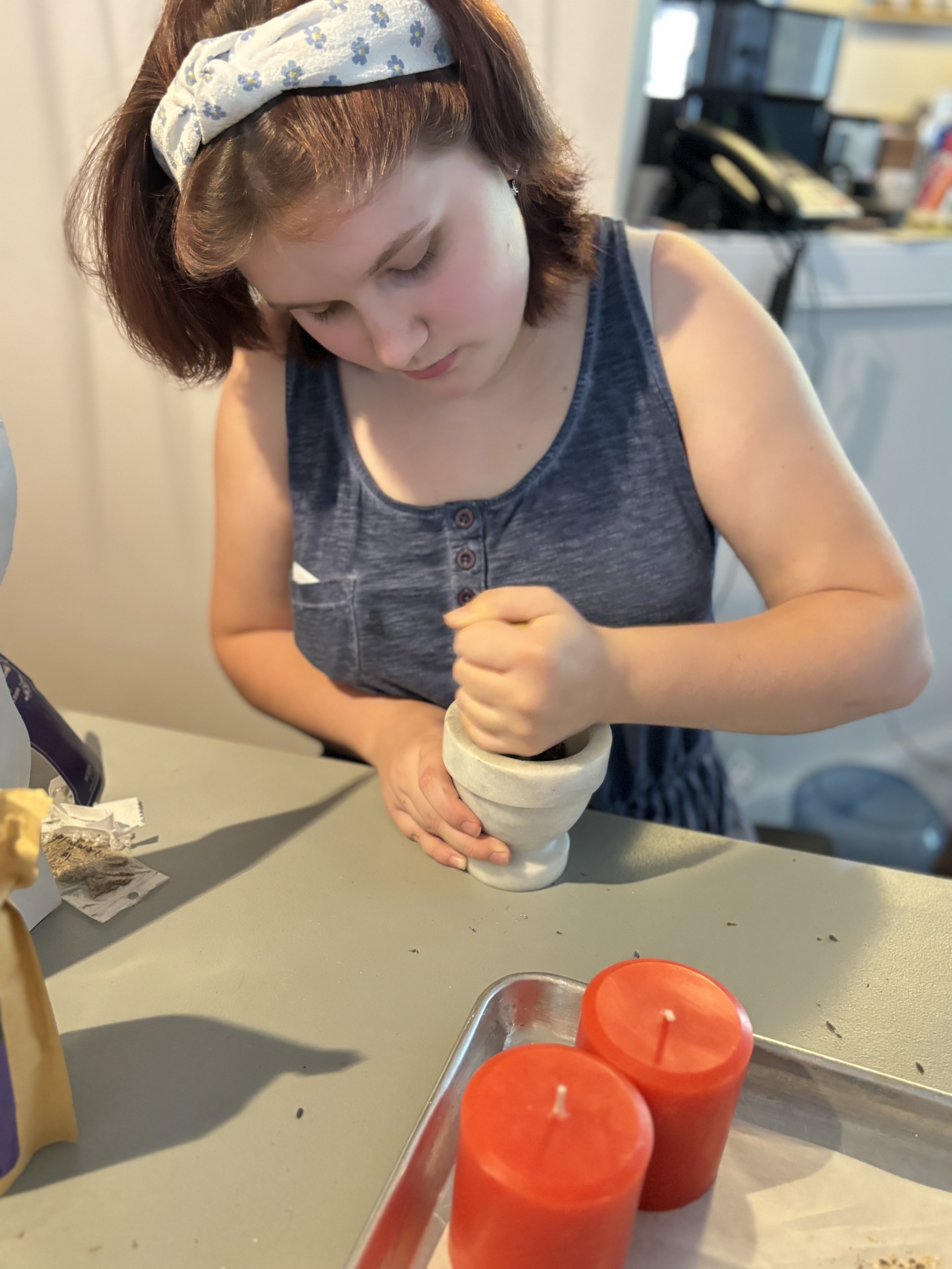 Lady using a mortar and pestle Lady using a mortar and pestle