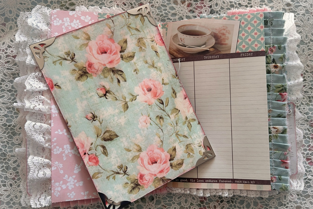 Handmade floral Journey Journal with pink roses, lace-trimmed pages, a writing space, and a vintage teacup illustration.