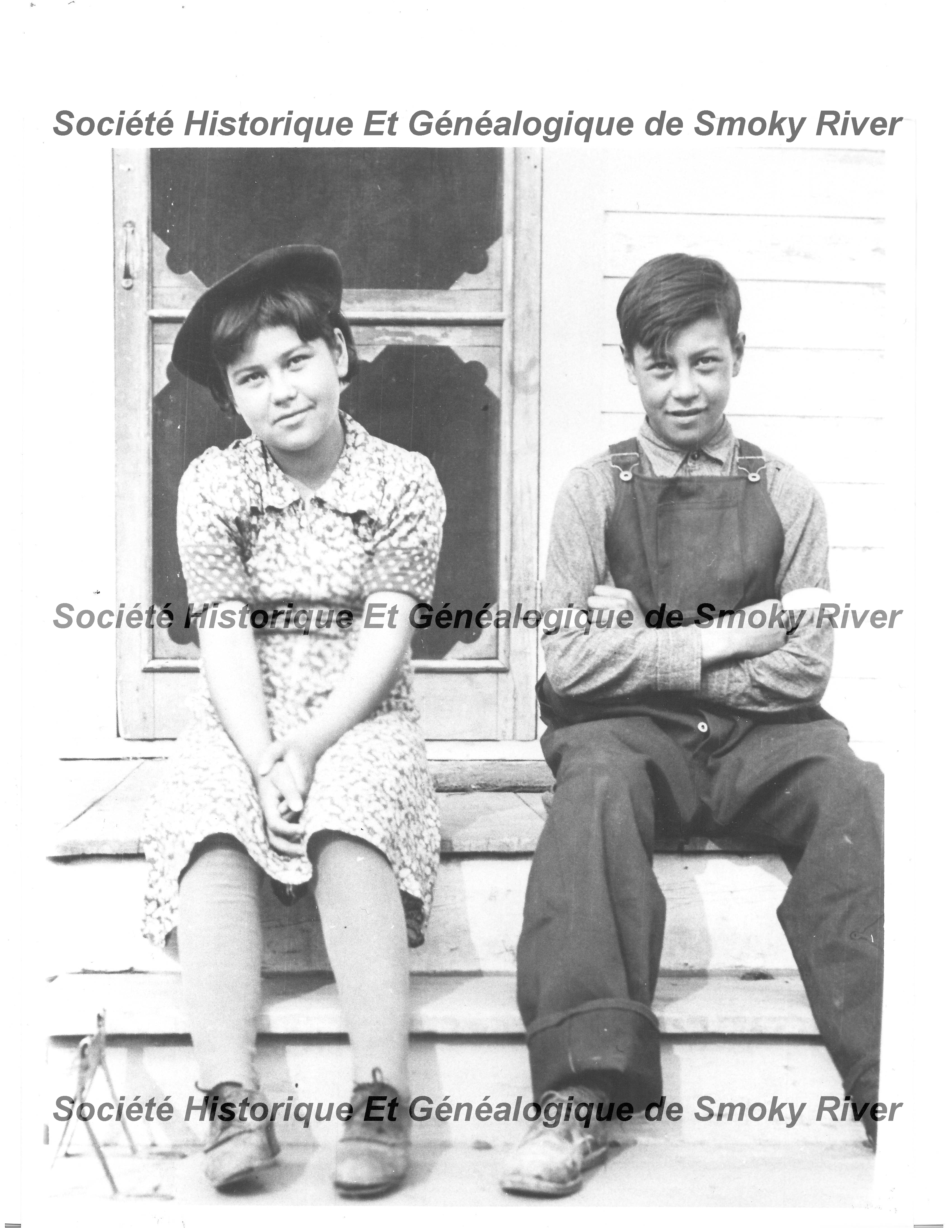 This photo is labelled "Two Shaw students from Peace River at the school in Fort Vermilion 1939". We are not sure if it is the public school, or Residential School but more importantly we are hoping that you can help us identify the bright young minds!
2006.01.80 / Societe Historique et Genealogique de Smoky River