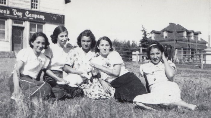 These ladies are sitting on the lawn in front of the Hudson's Bay Store in Buttertown. It's possible that some of them are sisters - or perhaps just friends enjoying a summer afternoon! Let us know if you recognize any of them!
2017.42.49 / Lizotte, Ramsey & Maria