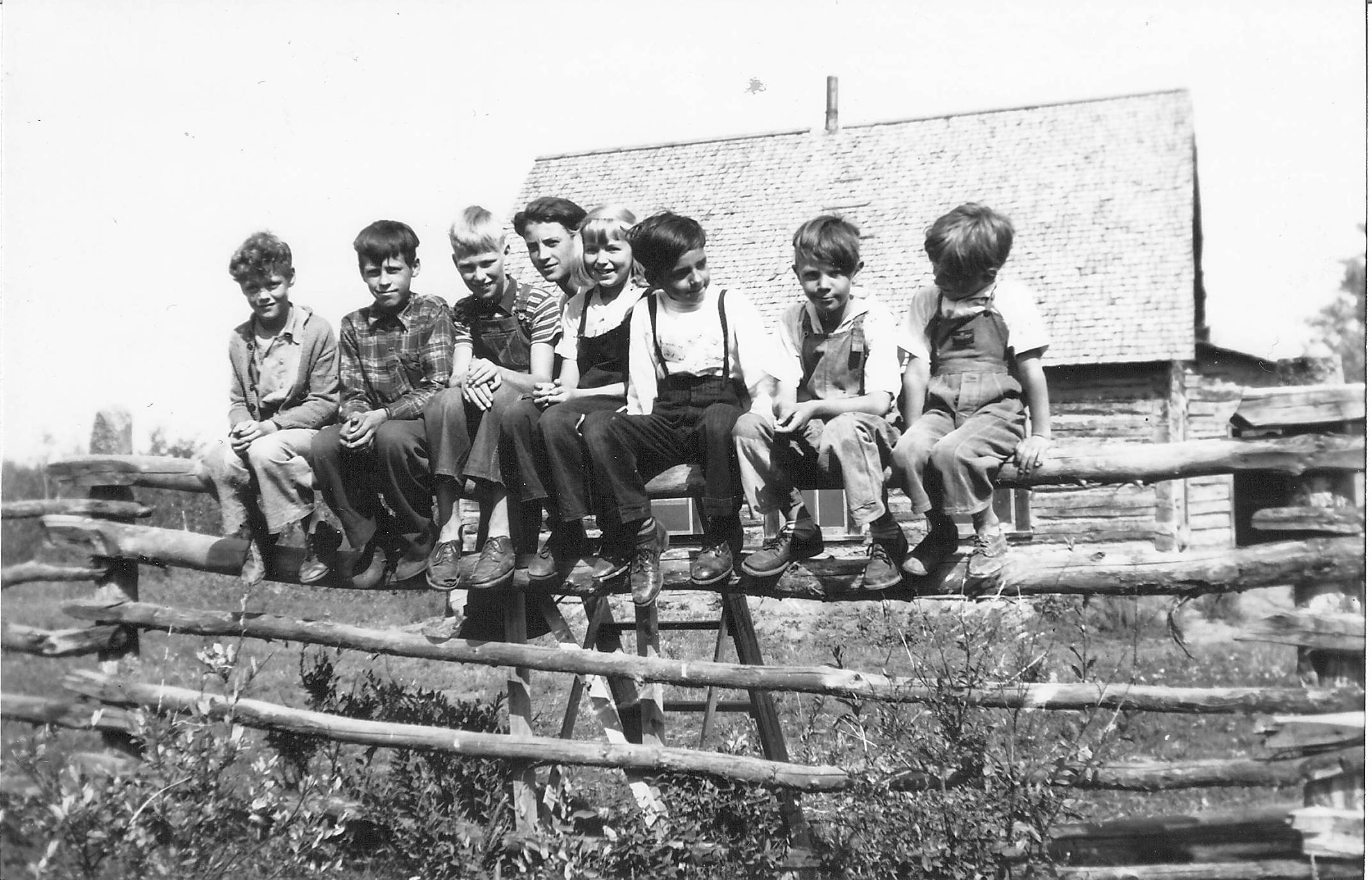 These unknown school children are comfortably gathered on the fence in front of the Lambert Point school in 1949. They appear to be various ages, and could be all the students from the school. In those years only 8 students were required to receive some provincial funding for school operations - the building, supplies and other portion of the teacher wages being the responsibility of the community or attending families. This Lambert Point school is in ruins but still on original location in Lambert Point - find it on our digital map here - https://www.google.com/maps/d/edit?mid=1DaLDWOdIkx98WeMedQtFdTe2FztYMMg and please let us know if you recognize these young minds!
990.4.3.8 / Bailey, G. Cook