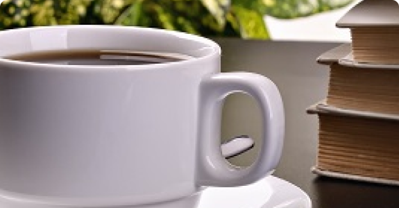 coffee cup and books