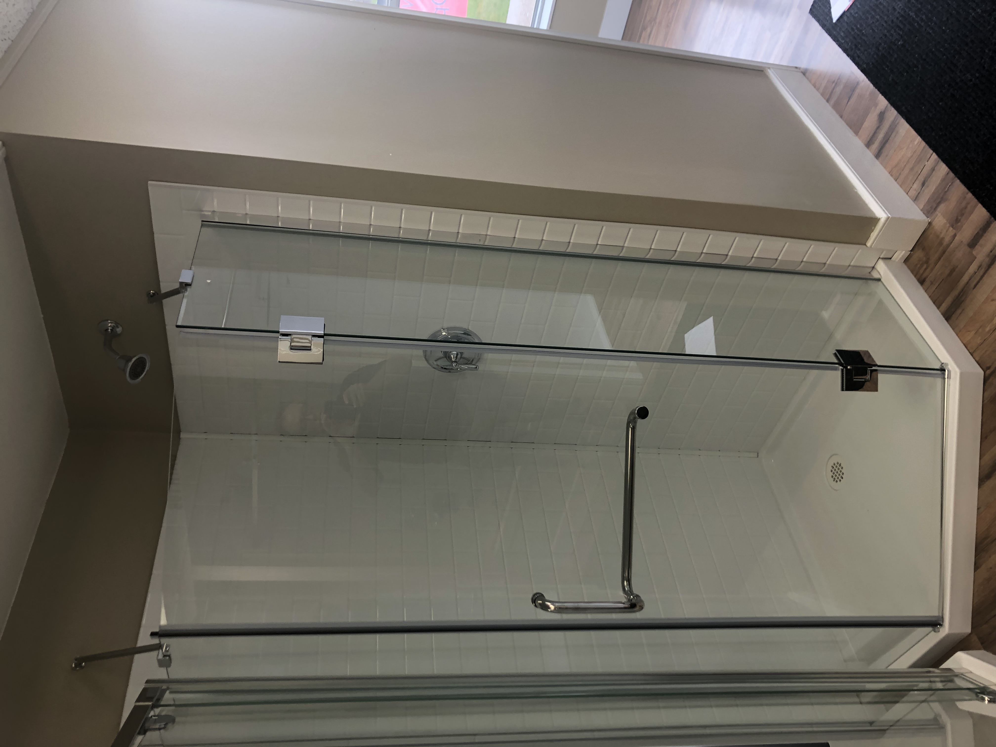 Modern bathroom with freestanding bathtub, large window, and minimalist decor.