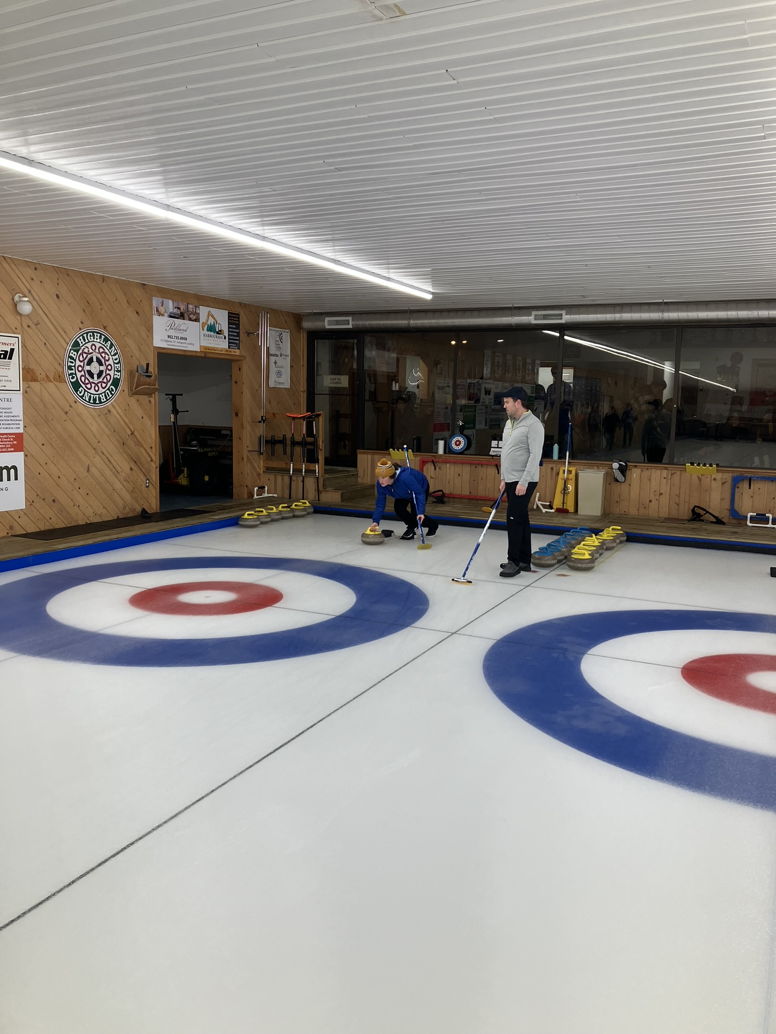 Maeve Ward about to throw, Teddy Stalker sweeping