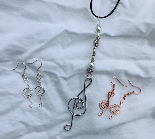 Treble clef Pendant and Earrings are hand wired using several types of wire, and beads are used for the pendant. Ideal gift for music lovers. $40.00 a set. Can be purchased separately.
