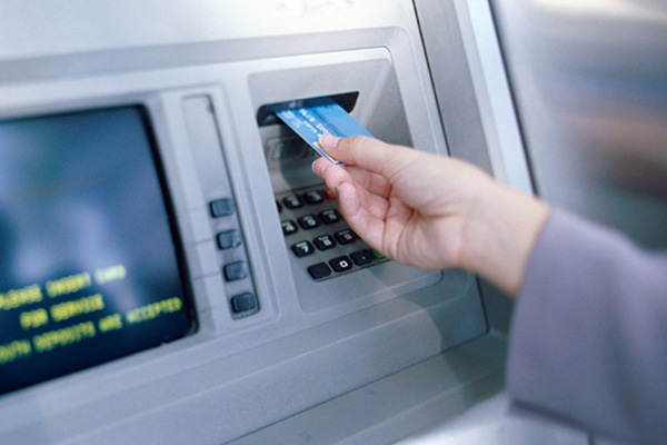 ATM card inserted into a machine ATM card inserted into a machine