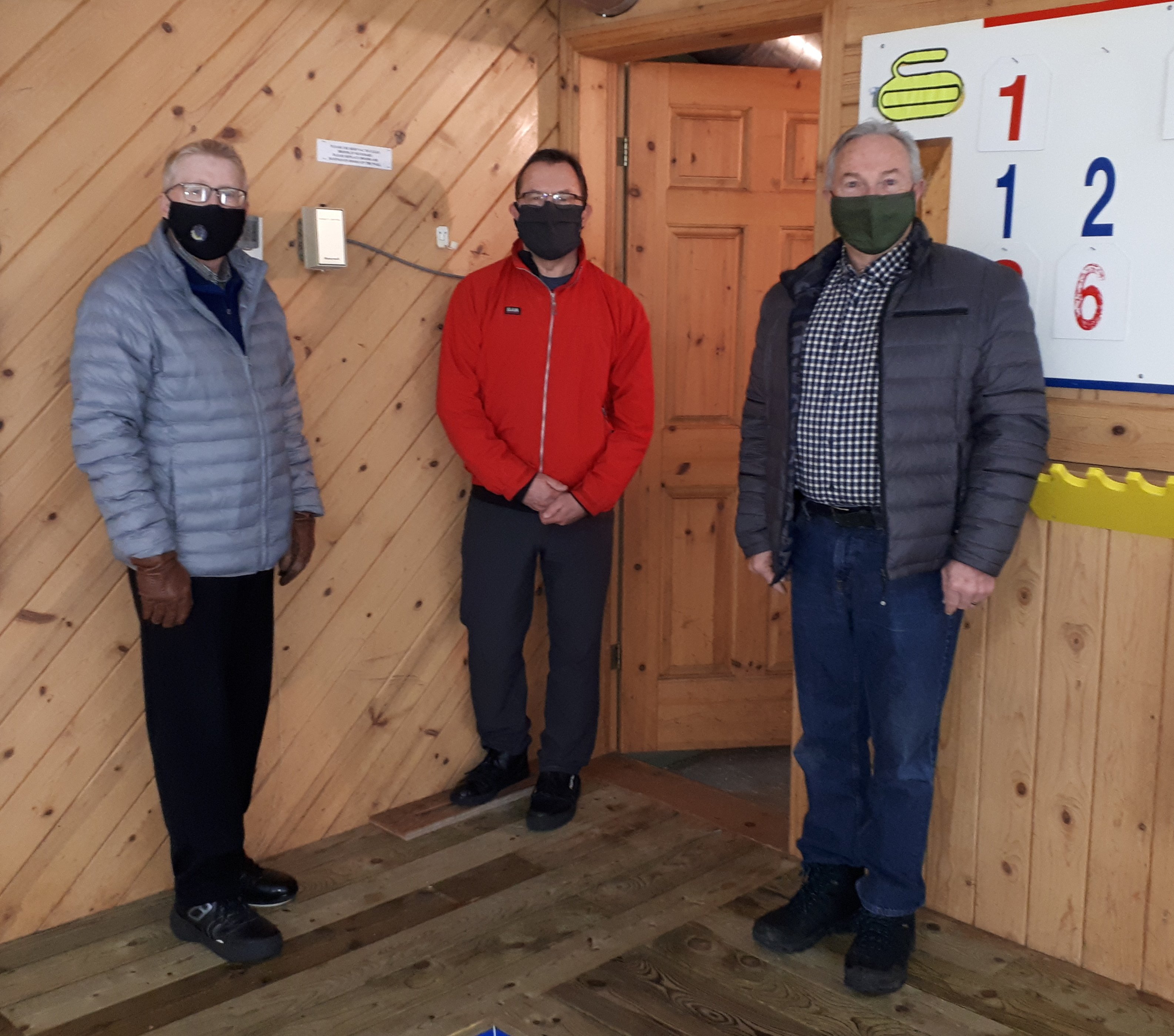 Len MacDonald, Lorne Deering and Owen McCarron with the new thermostat